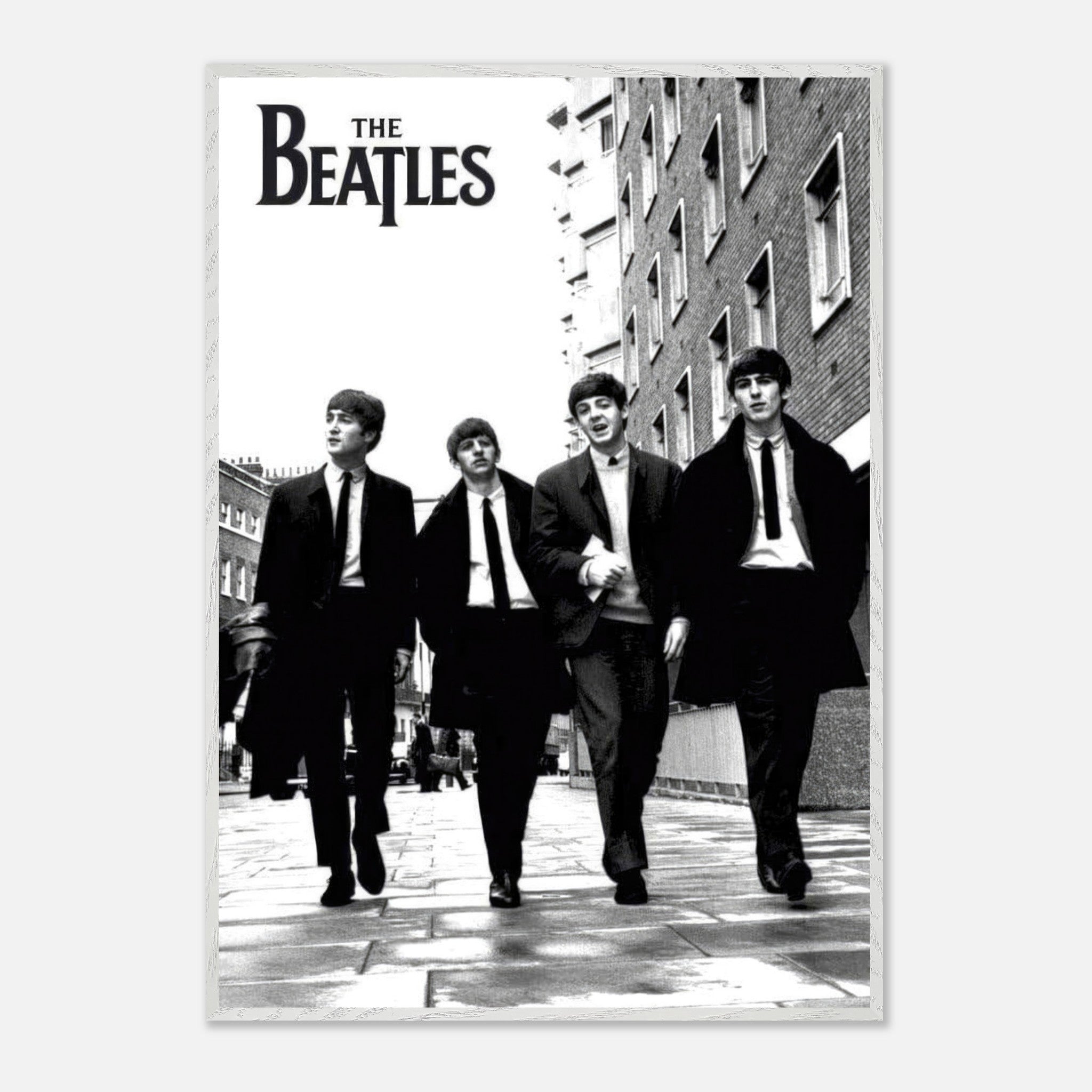 The Beatles fine art print in black and white, featuring the iconic band walking down a city street.