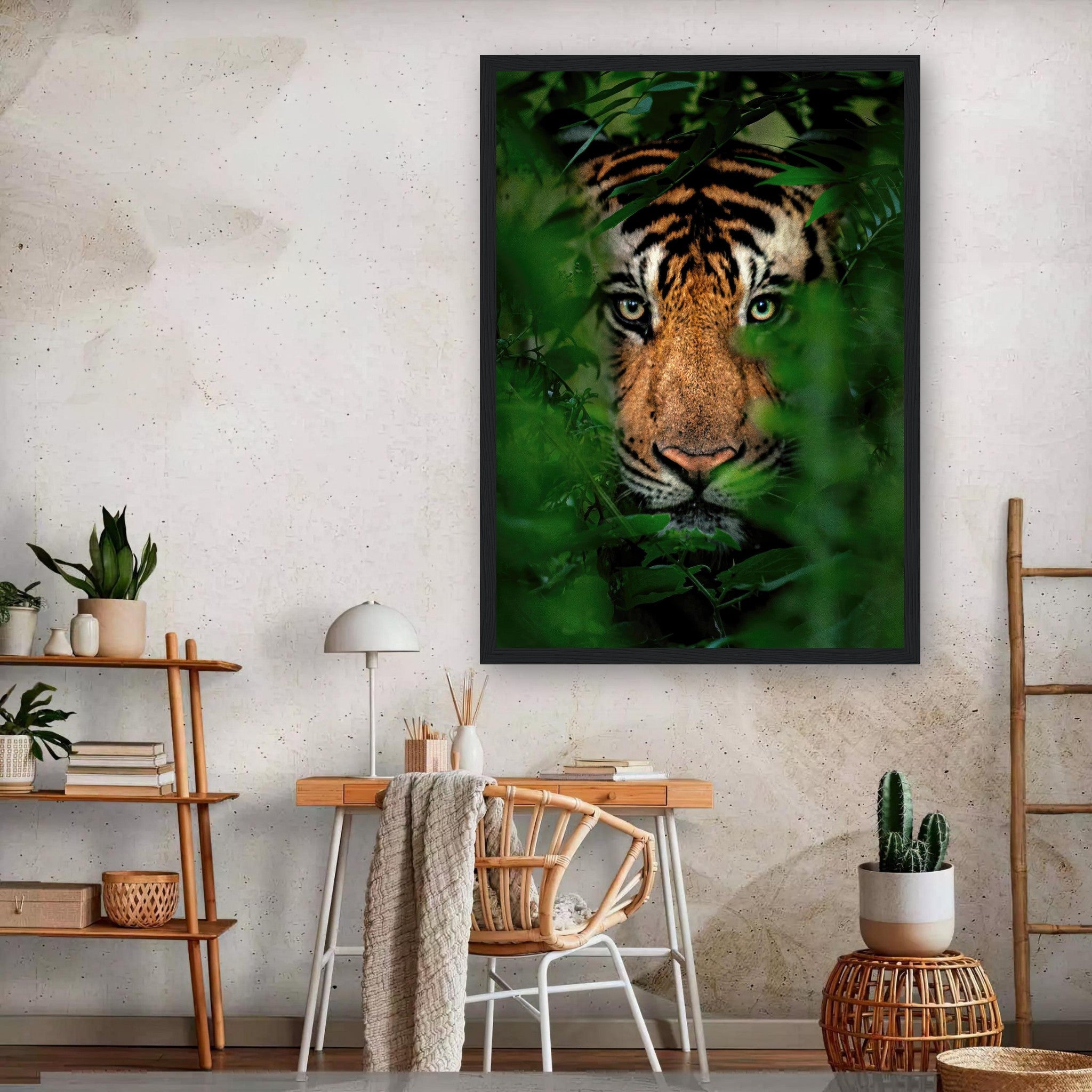 Framed print of a tiger peering through lush green jungle foliage in an interior setting.