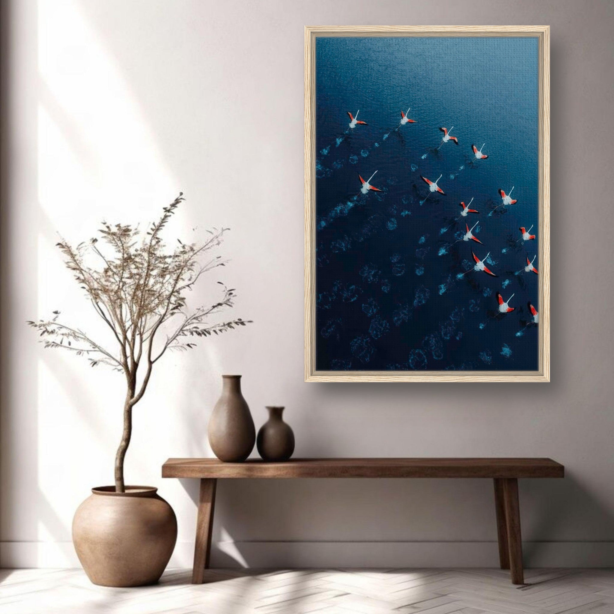 Framed canvas print of flamingos flying over deep blue waters, enhancing interior decor with nature's beauty.