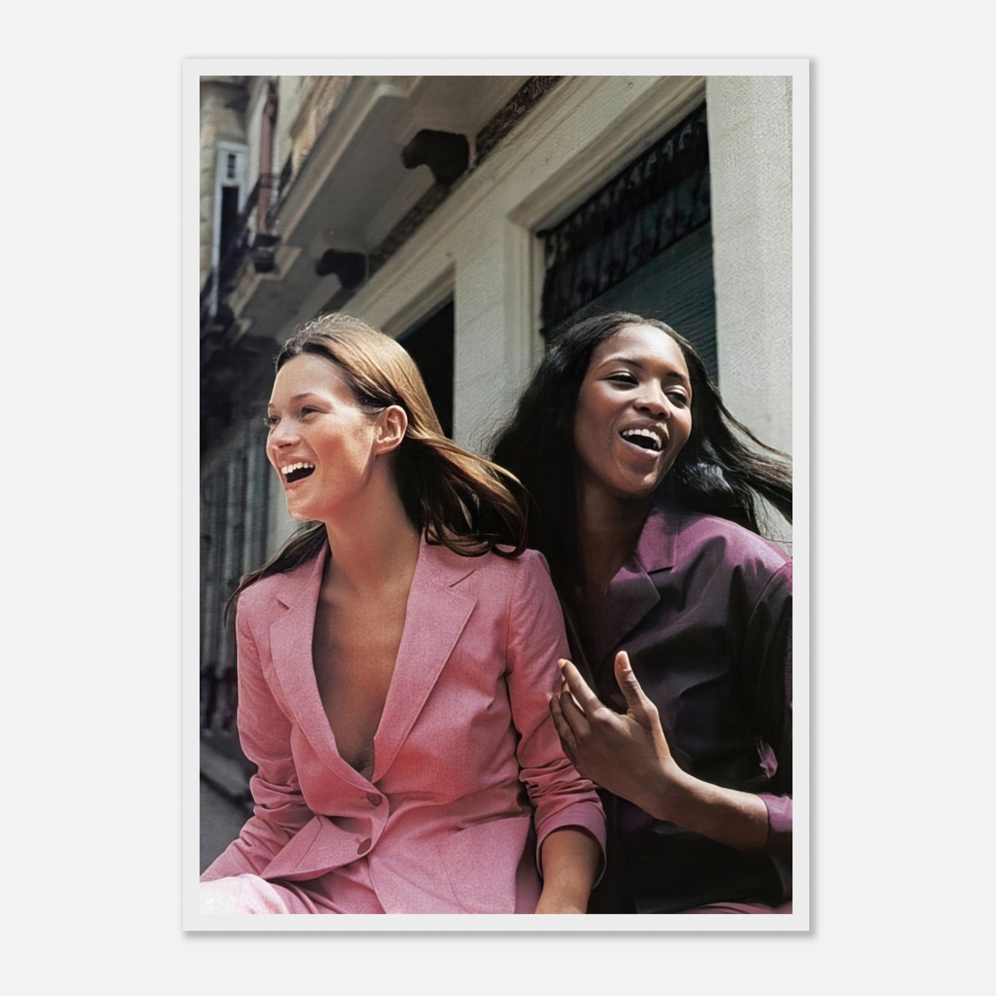 Framed print of Naomi Campbell and Kate Moss laughing, showcasing iconic fashion elegance and style.