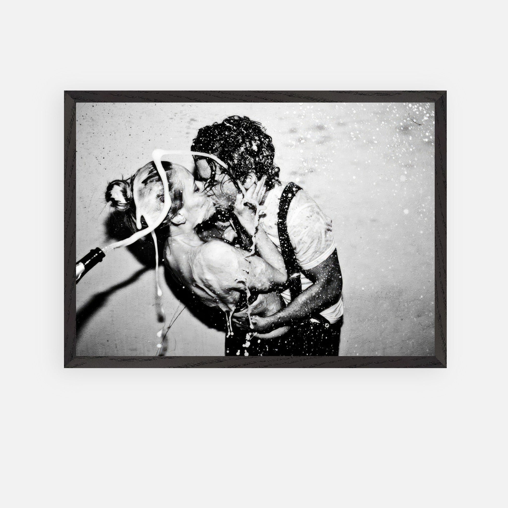 The Champagne Kiss fine art print of Johnny Depp and Kate Moss in black-and-white, capturing raw passion and romance.