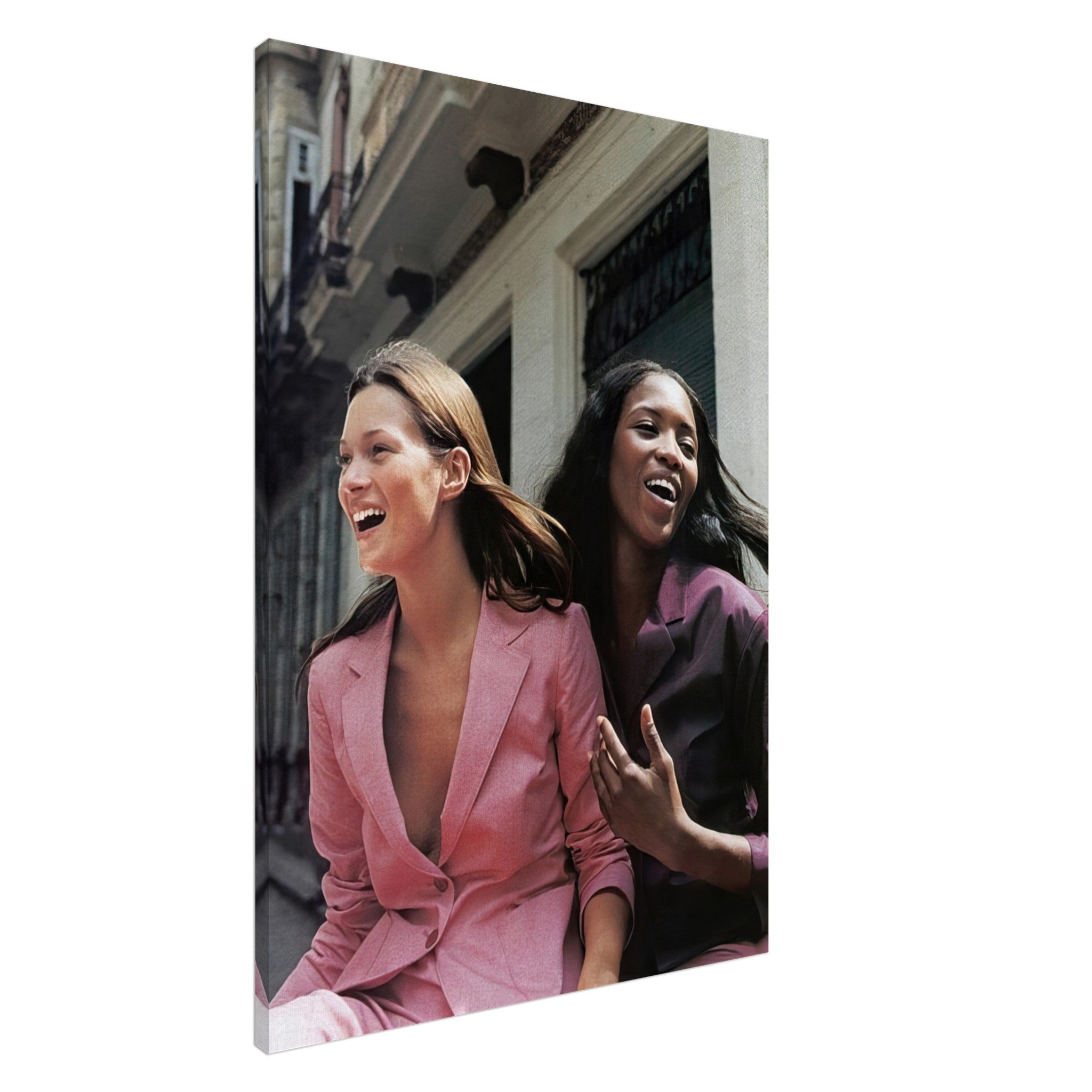 Naomi Campbell and Kate Moss canvas print showcasing iconic supermodels in vibrant fashion during a joyful moment.
