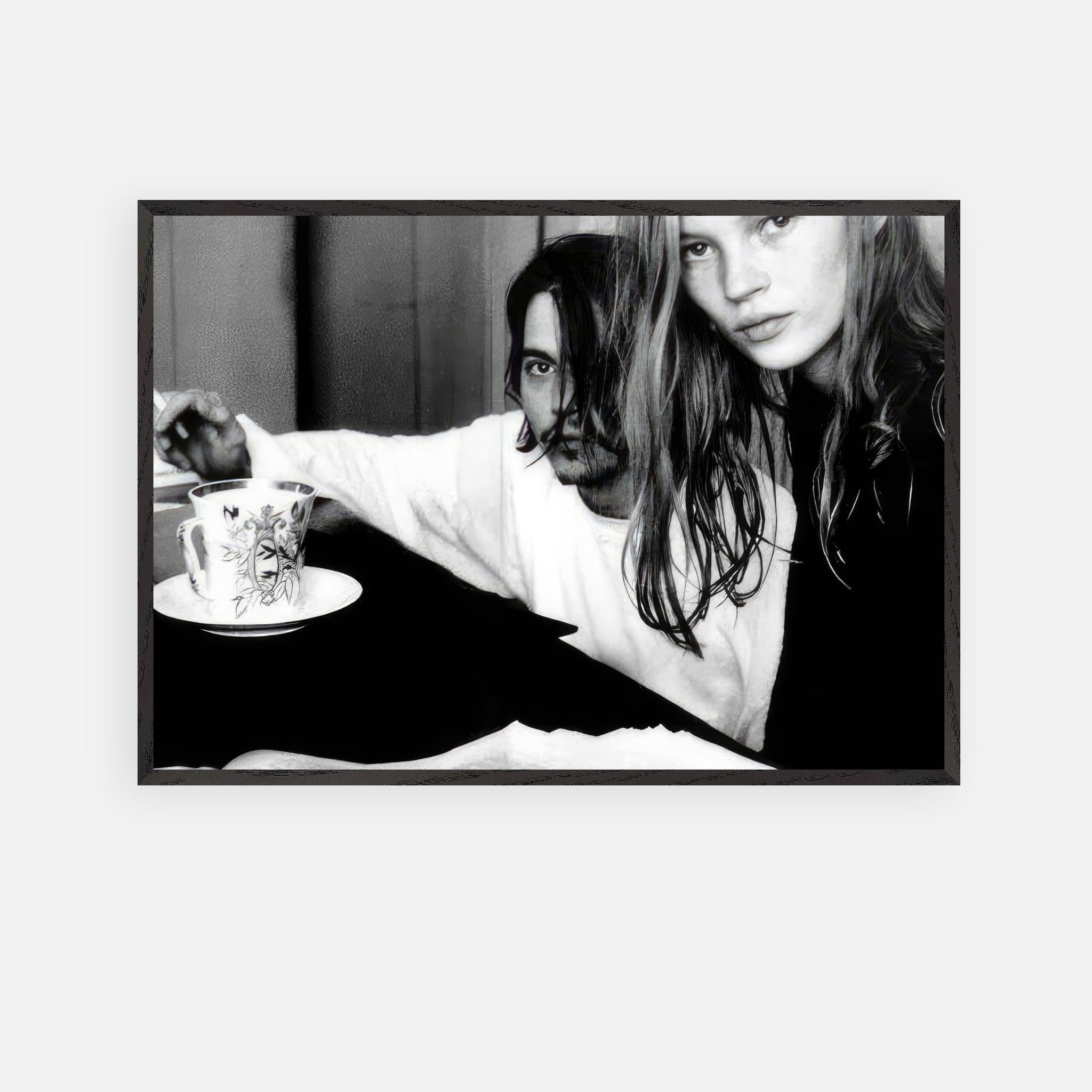 Vintage framed art of Johnny Depp and Kate Moss, capturing 90s romance and rebellion in a striking black-and-white portrait.