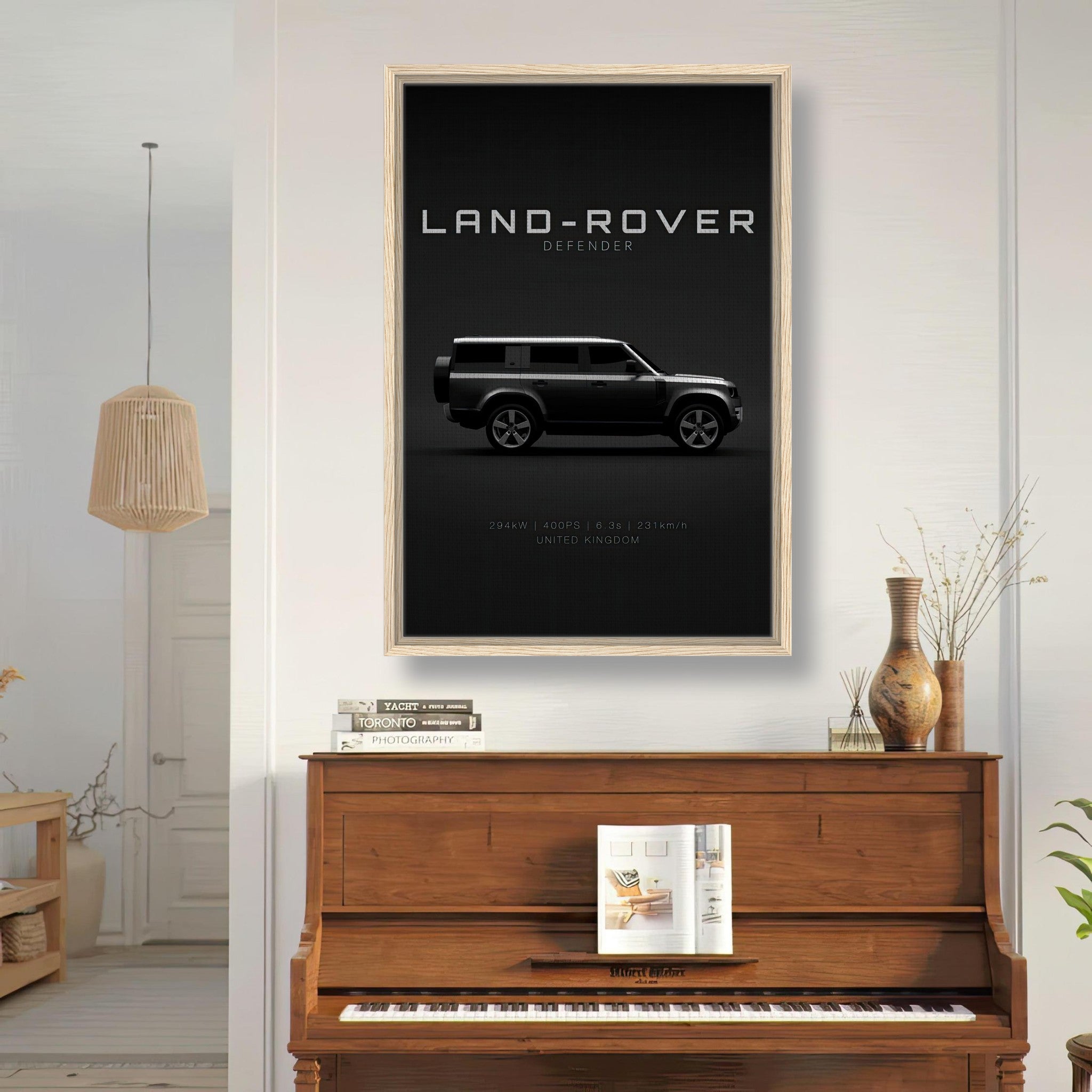 Land Rover Defender framed canvas print in a stylish interior, highlighting a sleek black backdrop.