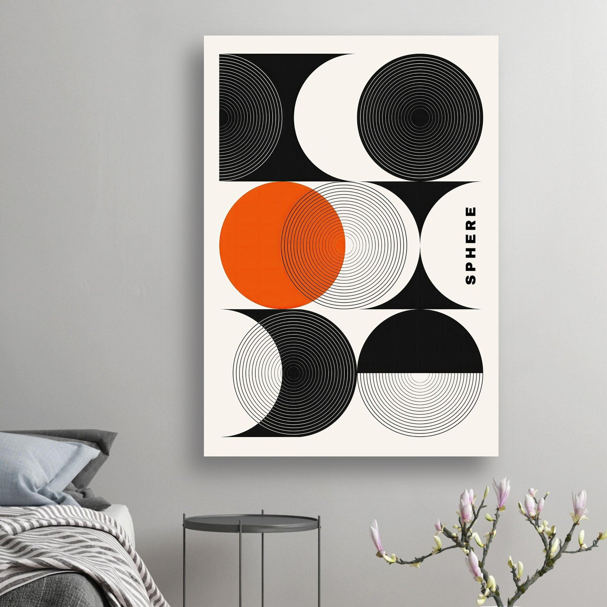 Abstract geometric sphere art poster in black, white, and orange on a wall, enhancing modern interior decor.