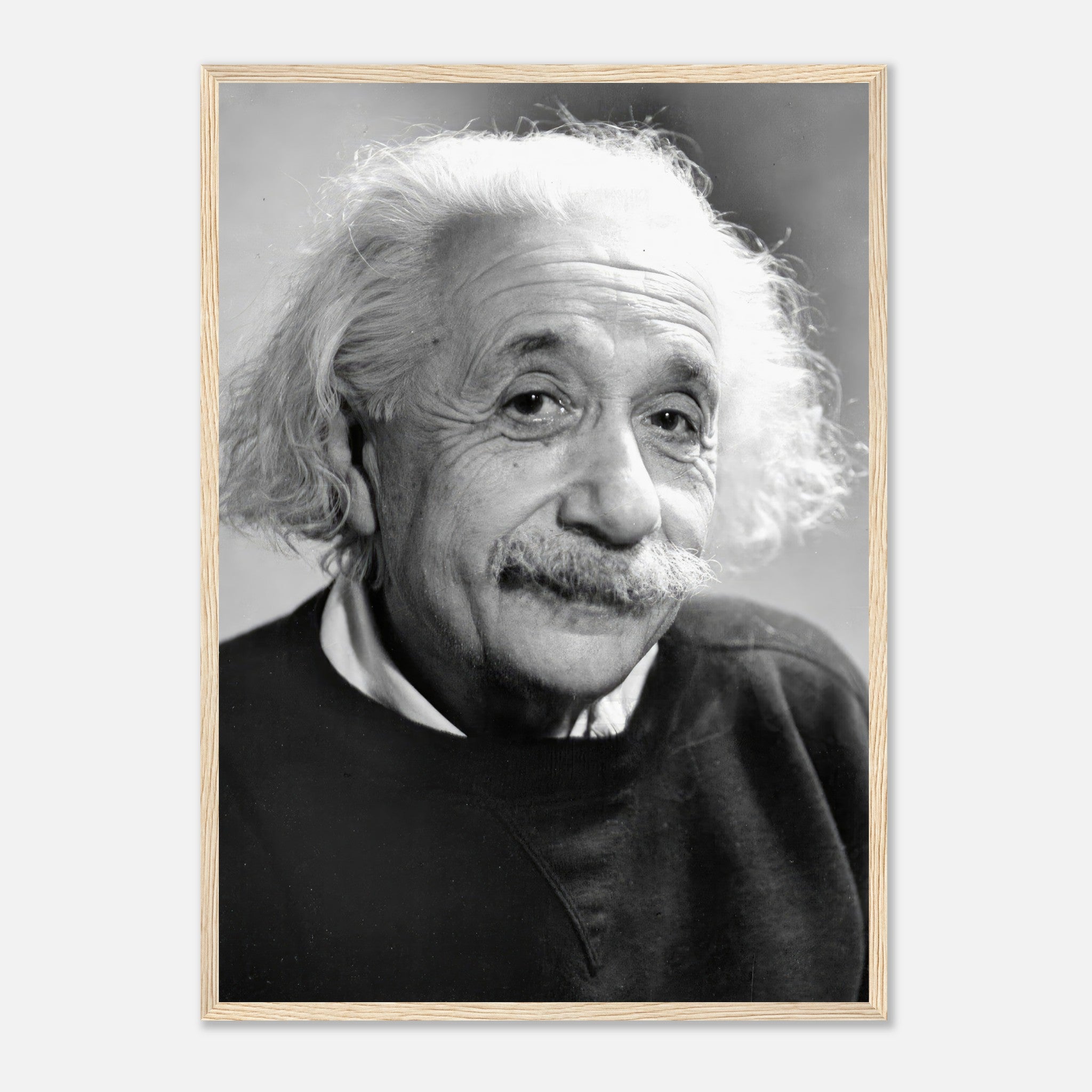 Framed black-and-white print of Albert Einstein (1946) showcasing his thoughtful expression and timeless charm.