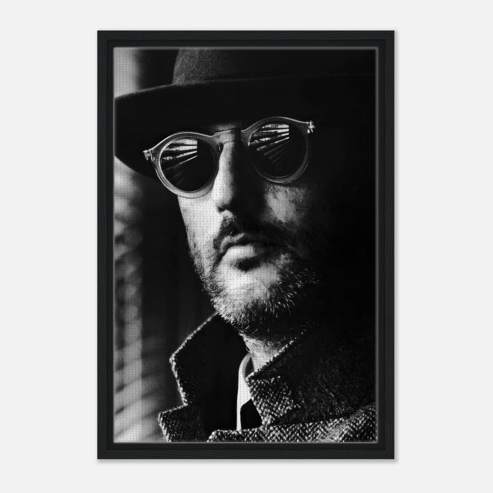 Framed canvas print of a man in sunglasses, showcasing timeless black-and-white photography.