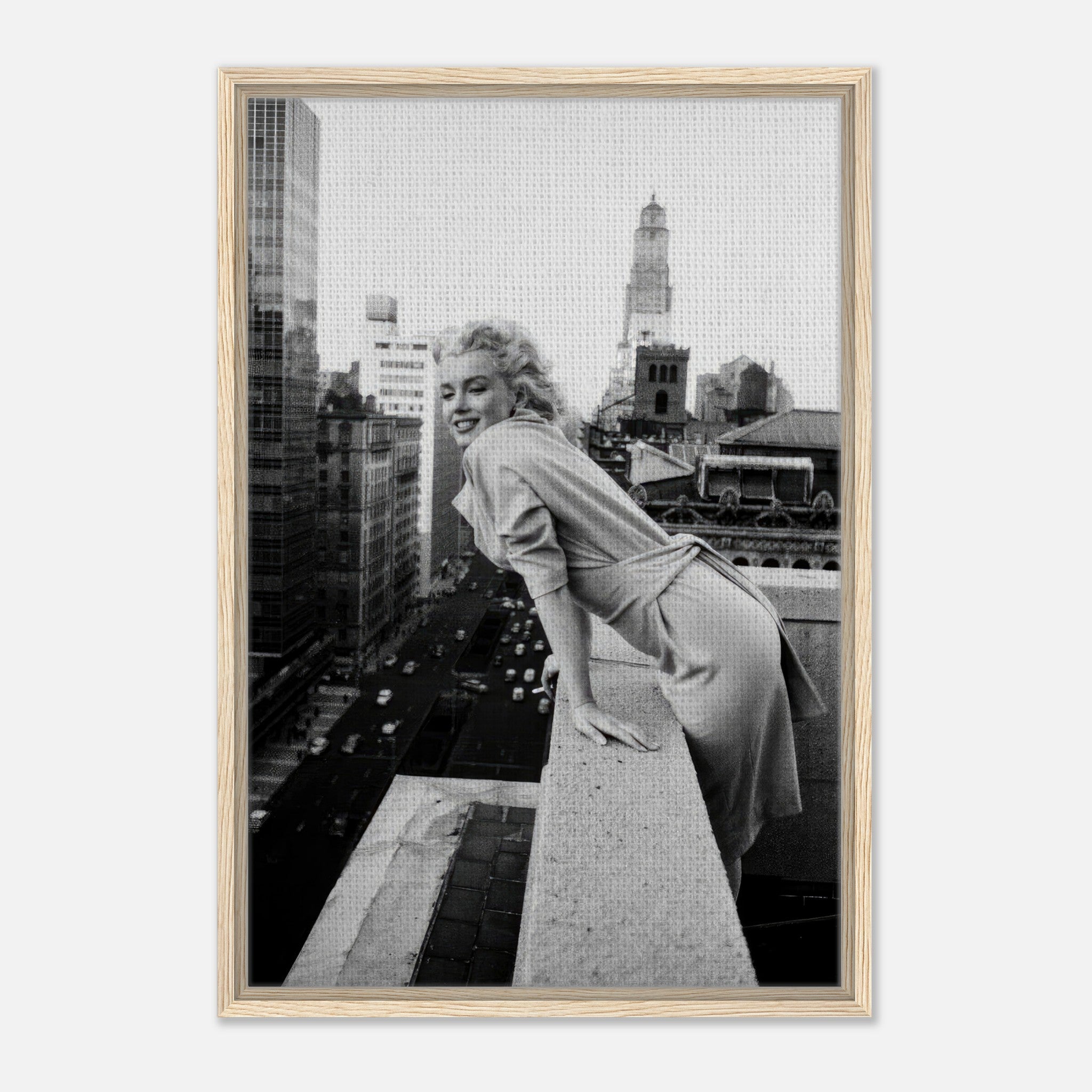 Marilyn Monroe smiling on a rooftop in New York City, framed black-and-white canvas art.