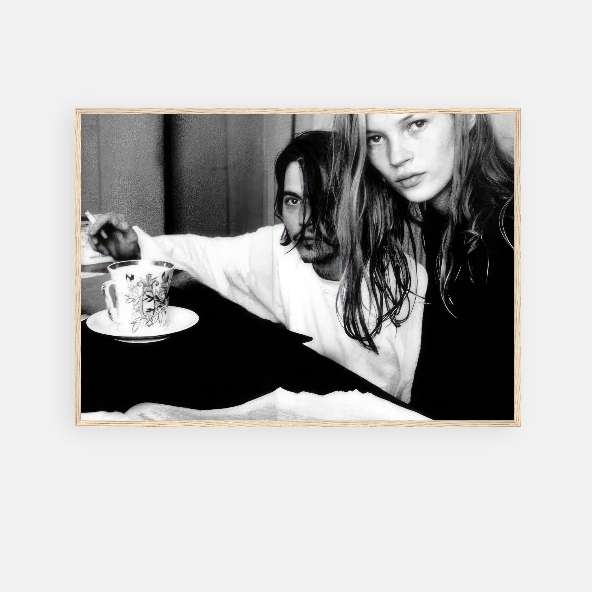 Black and white framed print of Johnny Depp and Kate Moss capturing 1990s romance and mystery.