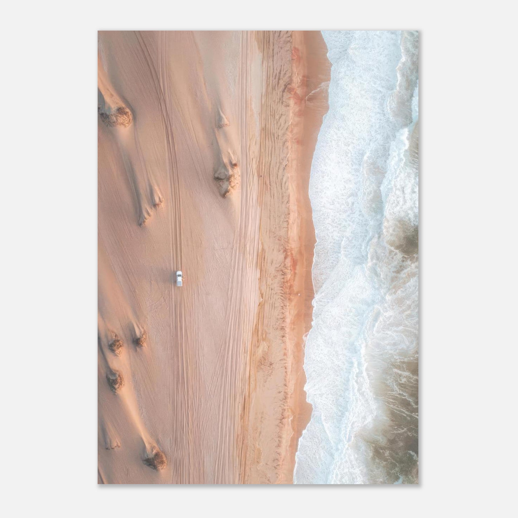 Aerial view of golden desert dunes meeting ocean waves in stunning drone photography poster.