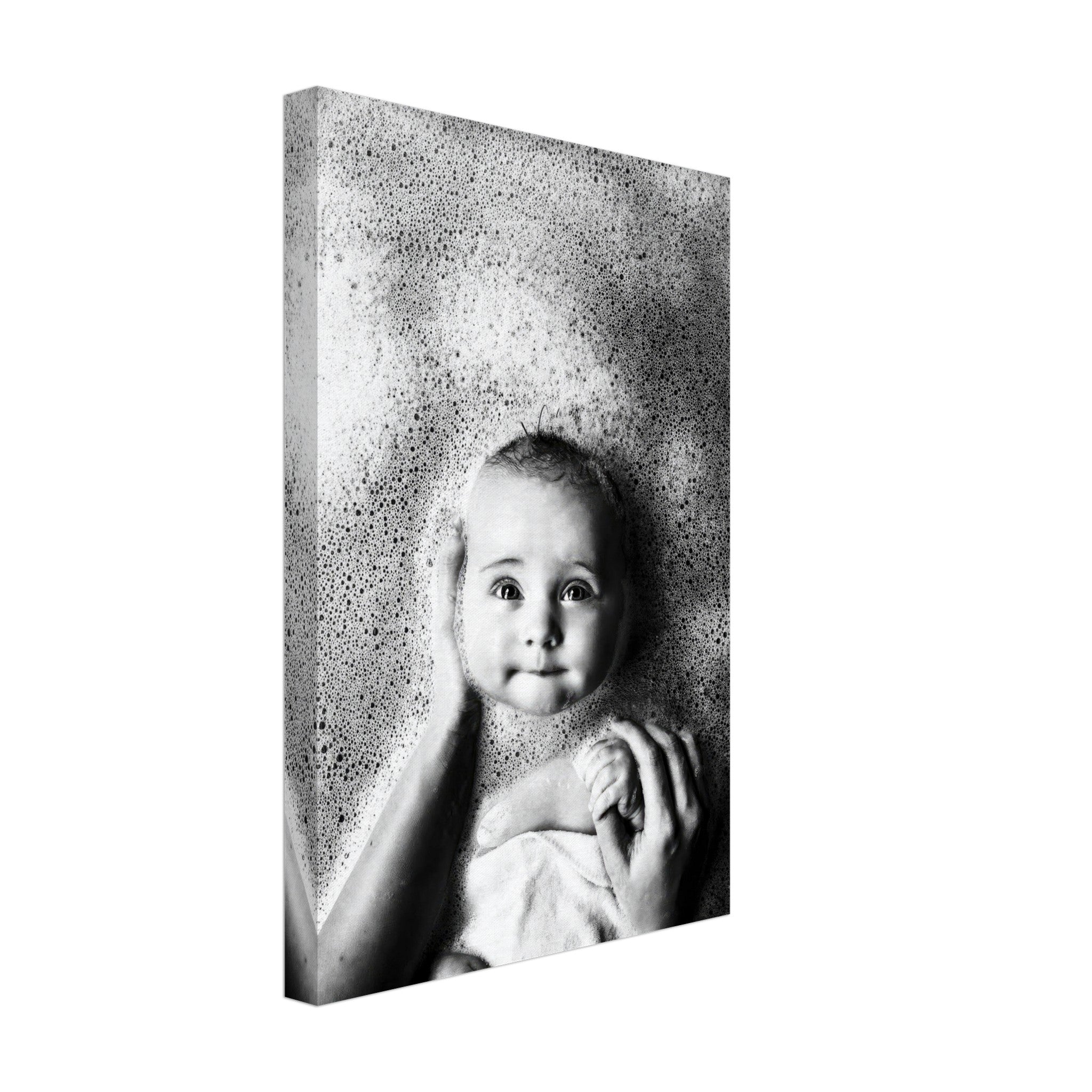 Black-and-white canvas print of a baby enjoying bath time, surrounded by bubbles, radiating joy and innocence.