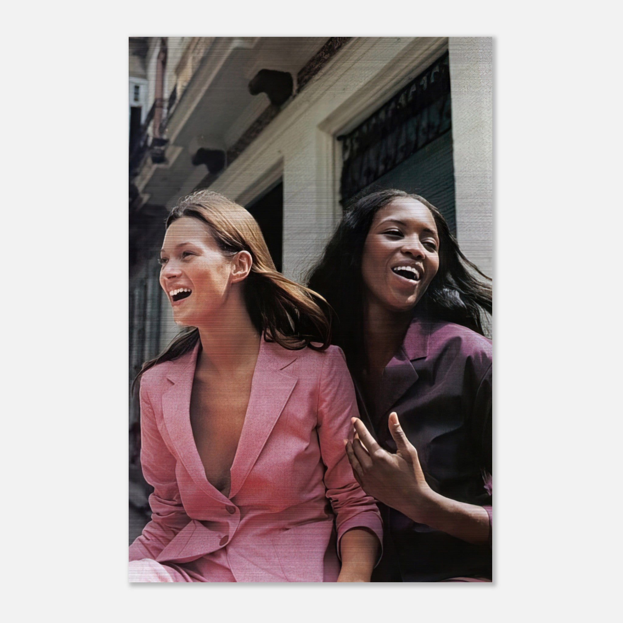 Naomi Campbell x Kate Moss Brushed Metal Print featuring iconic supermodels in stylish suits, exuding elegance and joy.