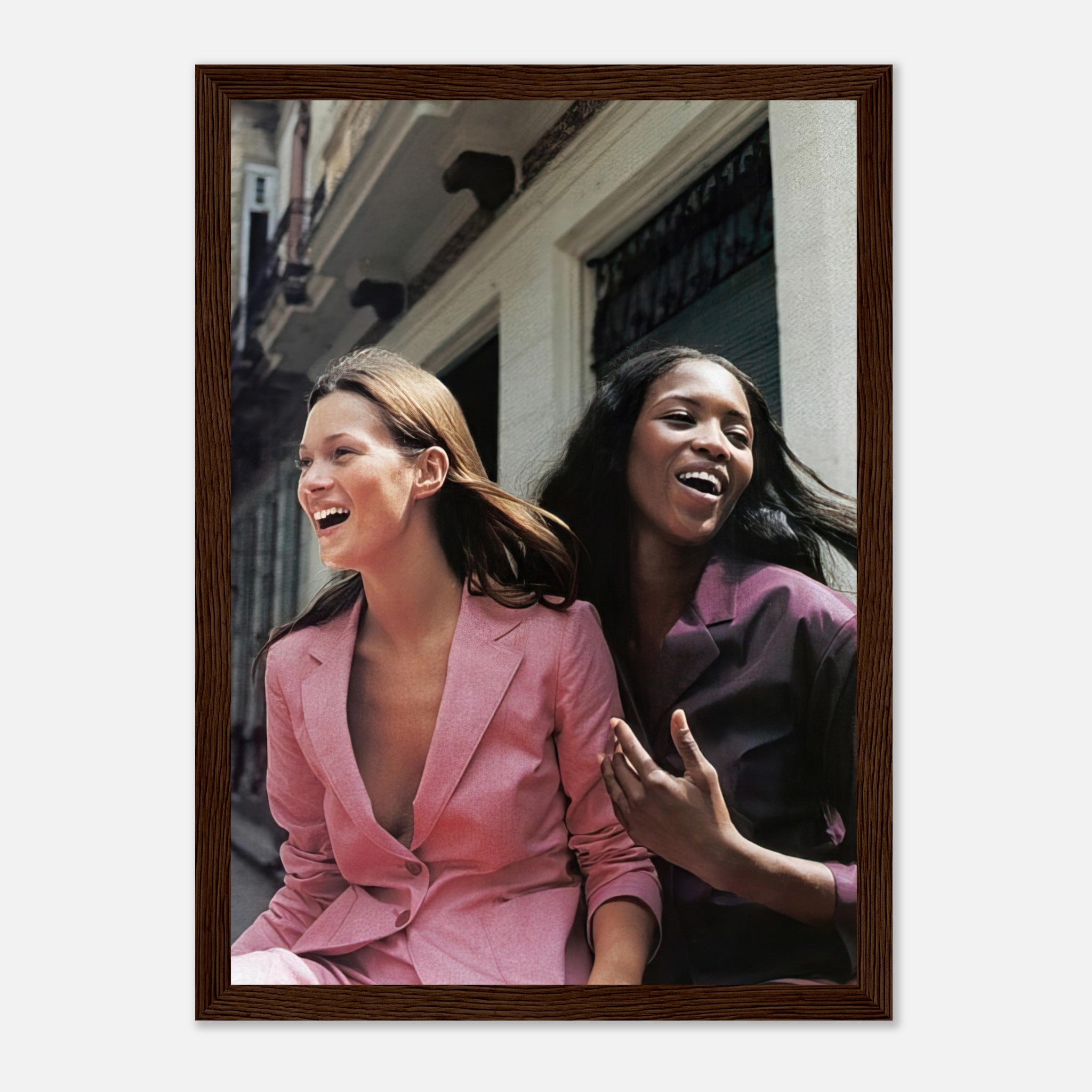 Framed print of Naomi Campbell and Kate Moss smiling, capturing iconic fashion moments and timeless elegance.