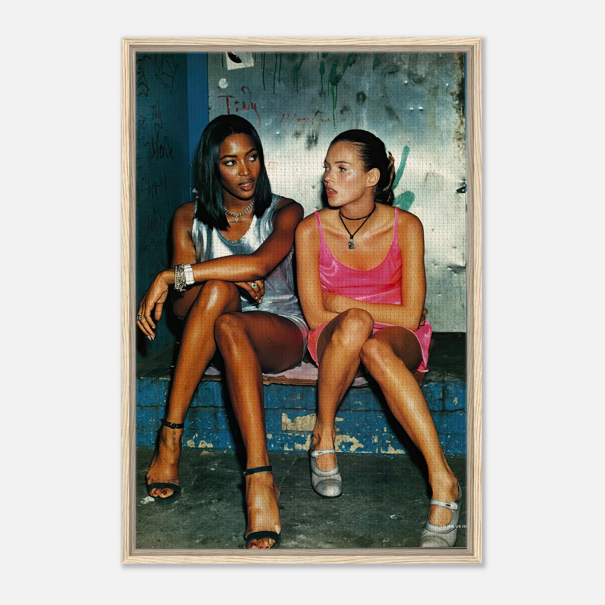 Naomi Campbell and Kate Moss framed canvas print capturing 90s supermodel glamour in a candid moment.