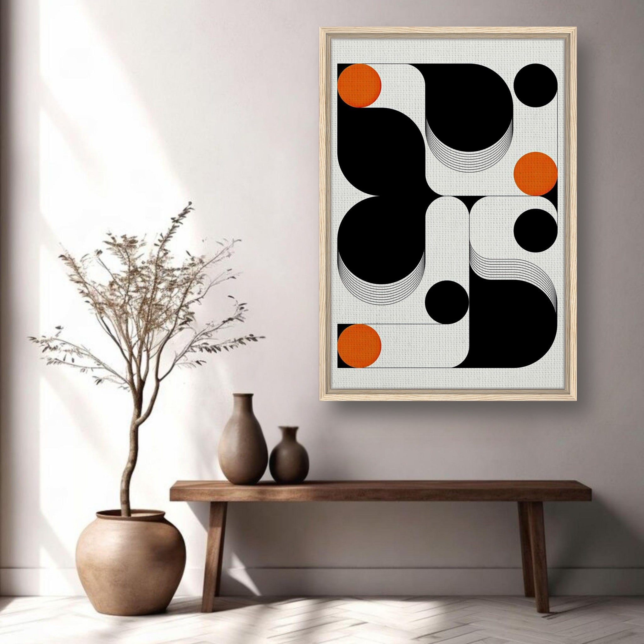 Modern geometric abstract art framed canvas print in a stylish living space with black and orange shapes.