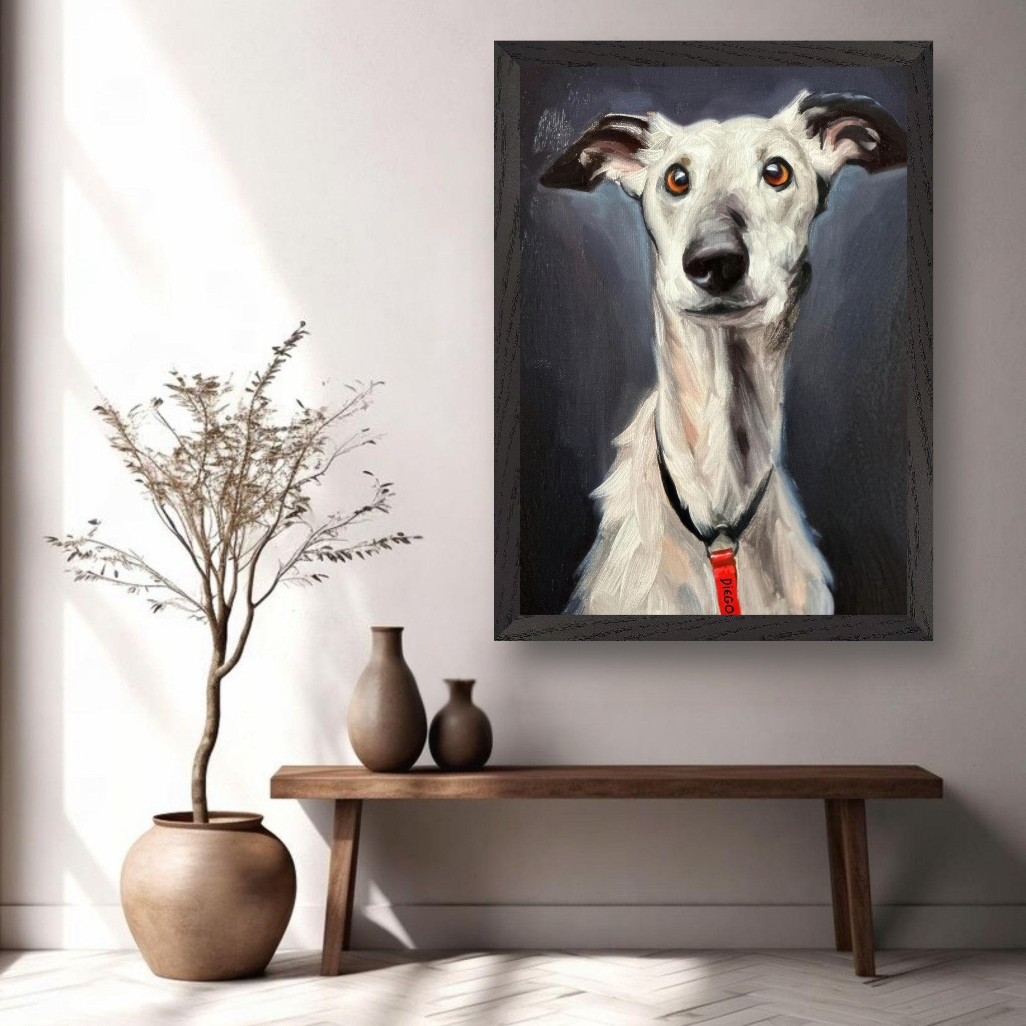 Greyhound dog painting in vintage frame, showcasing a noble expression, displayed in a stylish home setting.