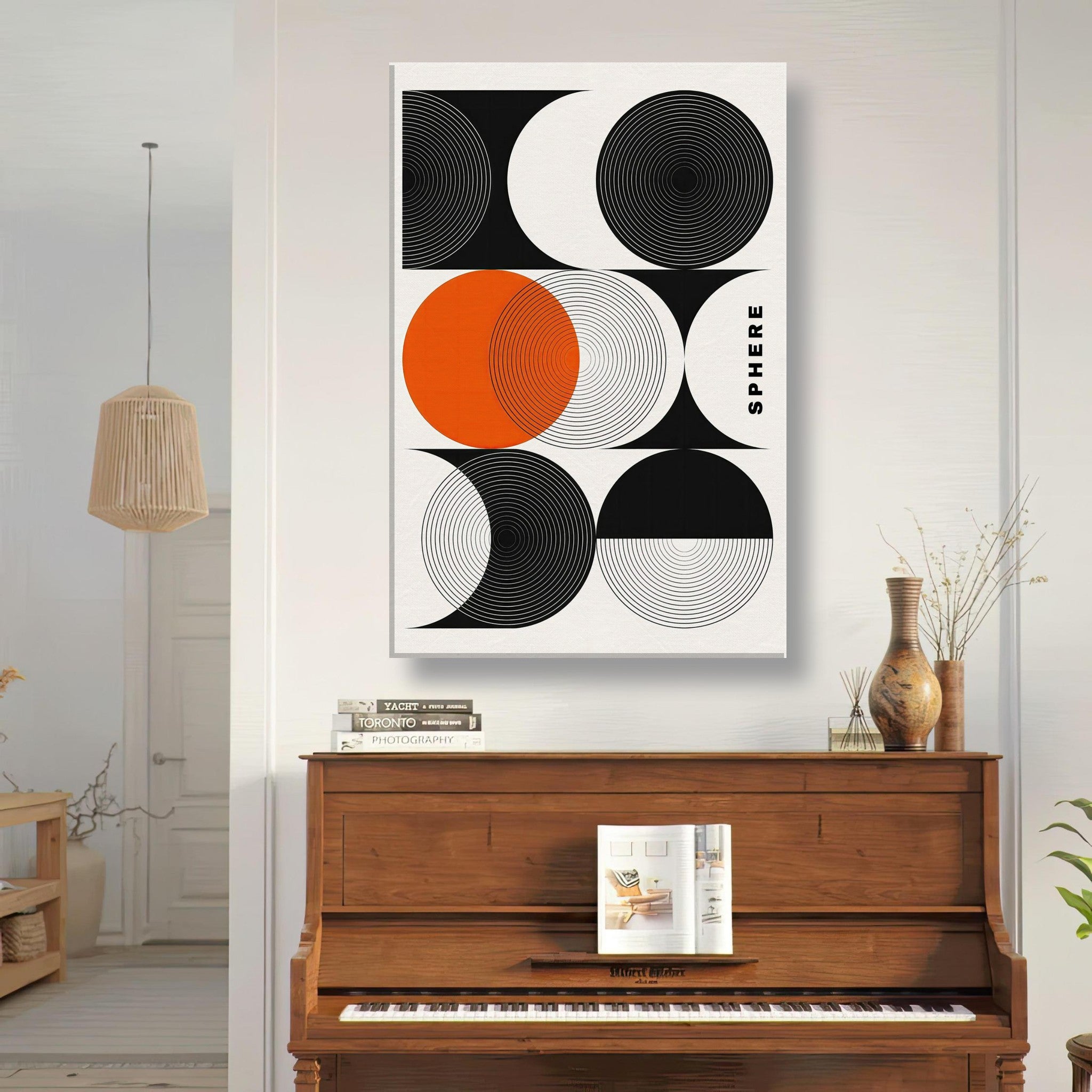Abstract geometric sphere canvas print with circular patterns in black, white, and vibrant orange for modern decor.