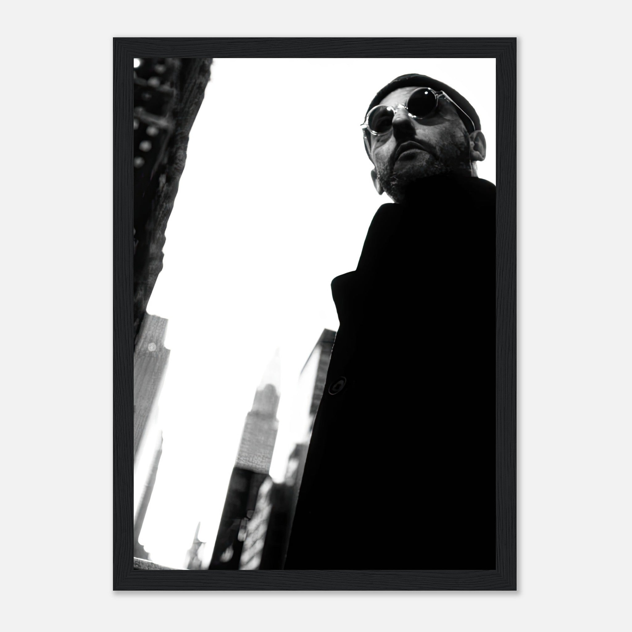 Framed print of Jean Reno in a bold black-and-white portrait, showcasing cinematic artistry and urban aesthetics.