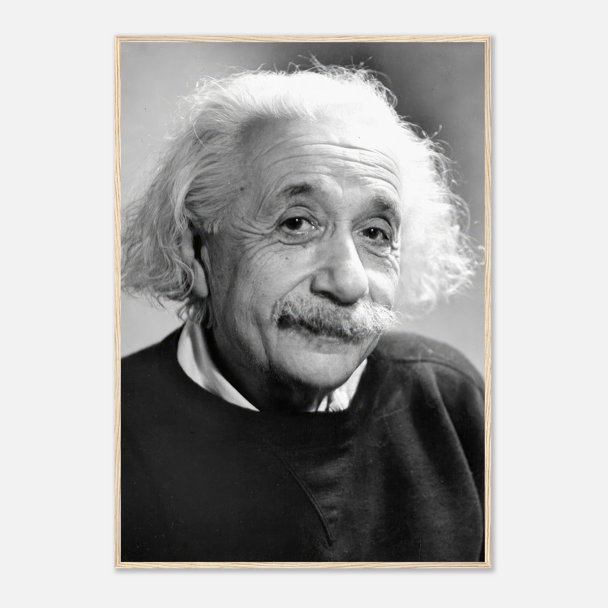 Black-and-white framed print of Albert Einstein (1946), showcasing his thoughtful expression and iconic features.