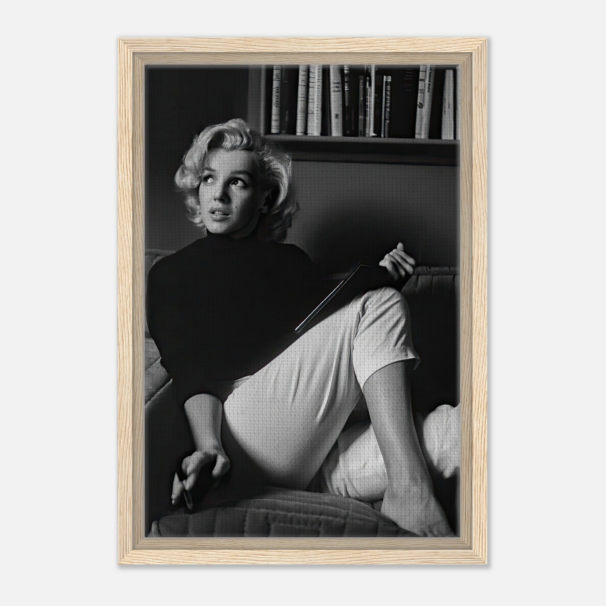 Marilyn Monroe framed canvas print reading book, black and white art, elegant home decor piece.