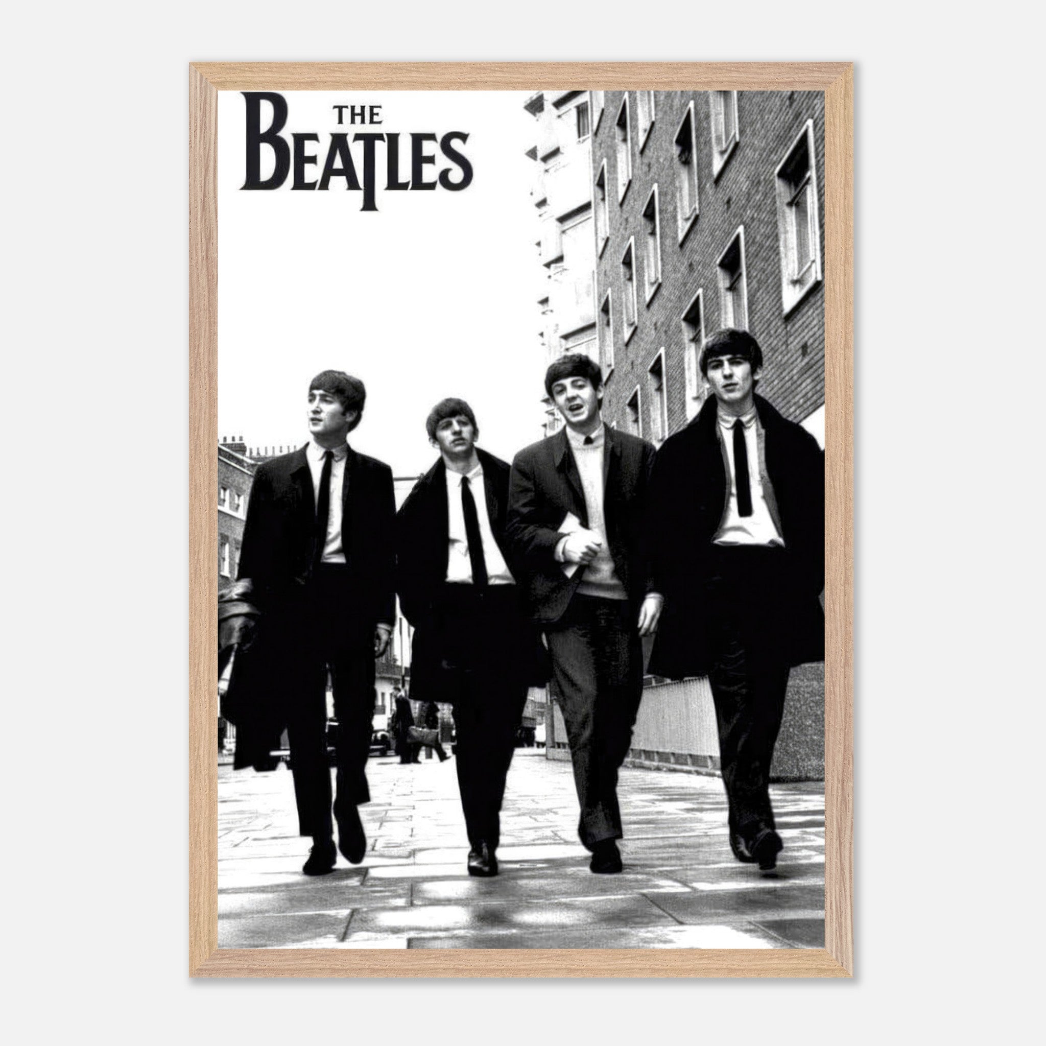 The Beatles vintage framed print featuring iconic band members walking down the street in black and white.