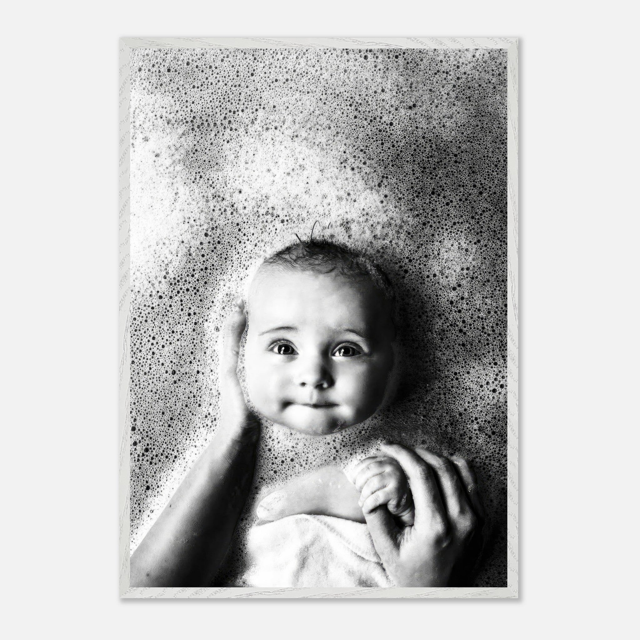 Vintage black and white baby bath photography with soft bubbles, capturing innocence and nostalgia.
