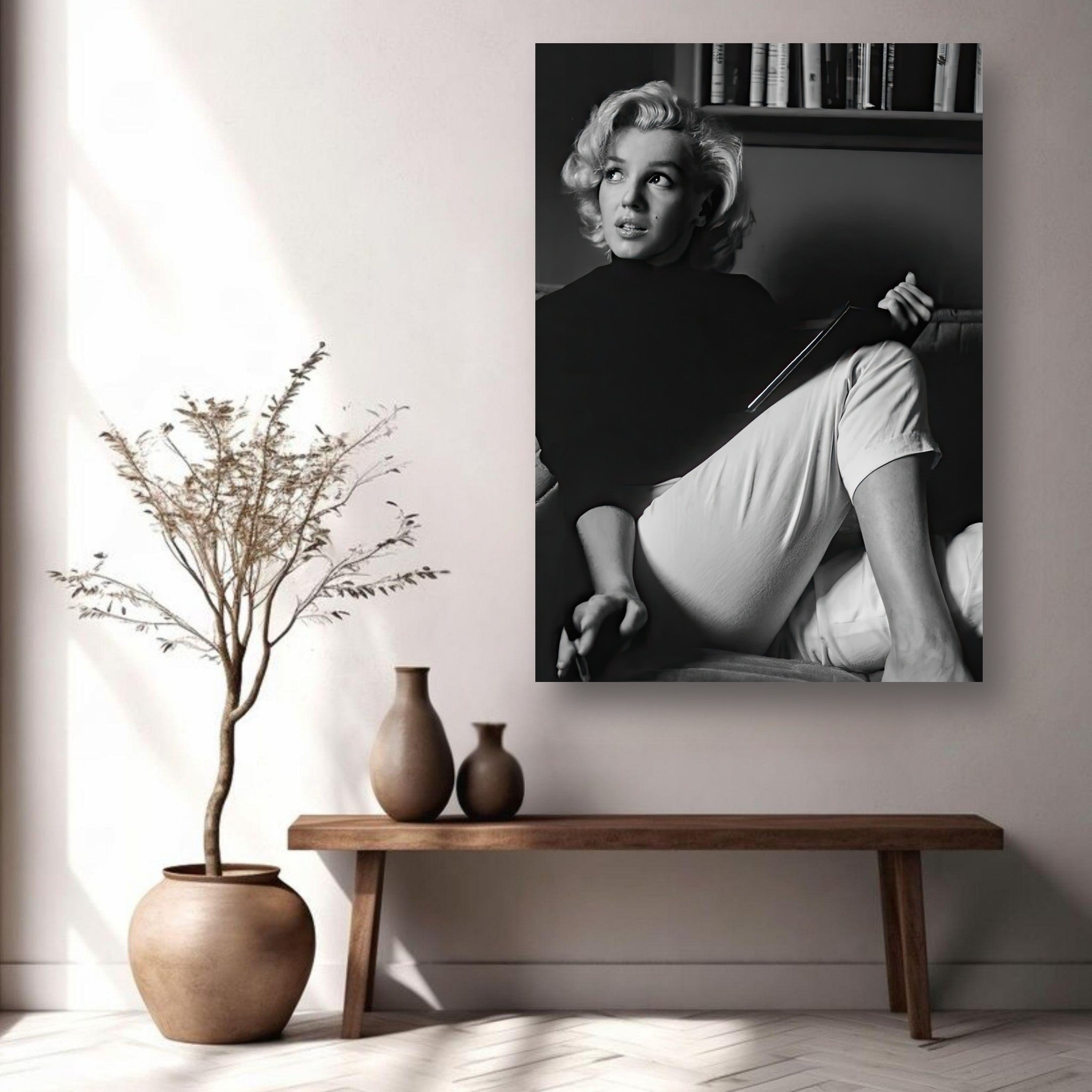 Marilyn Monroe reading a book in a stylish black-and-white metal print, showcasing elegance and intellect.