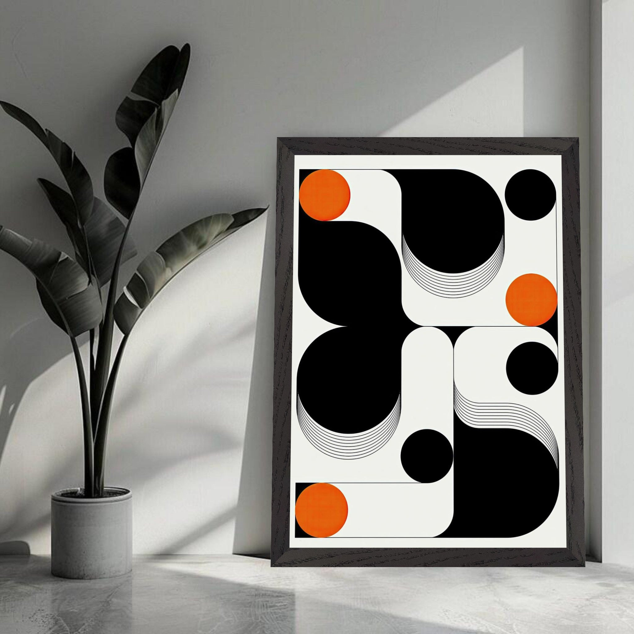 Modern geometric abstract art print with black, white, and vibrant orange shapes in a vintage frame.