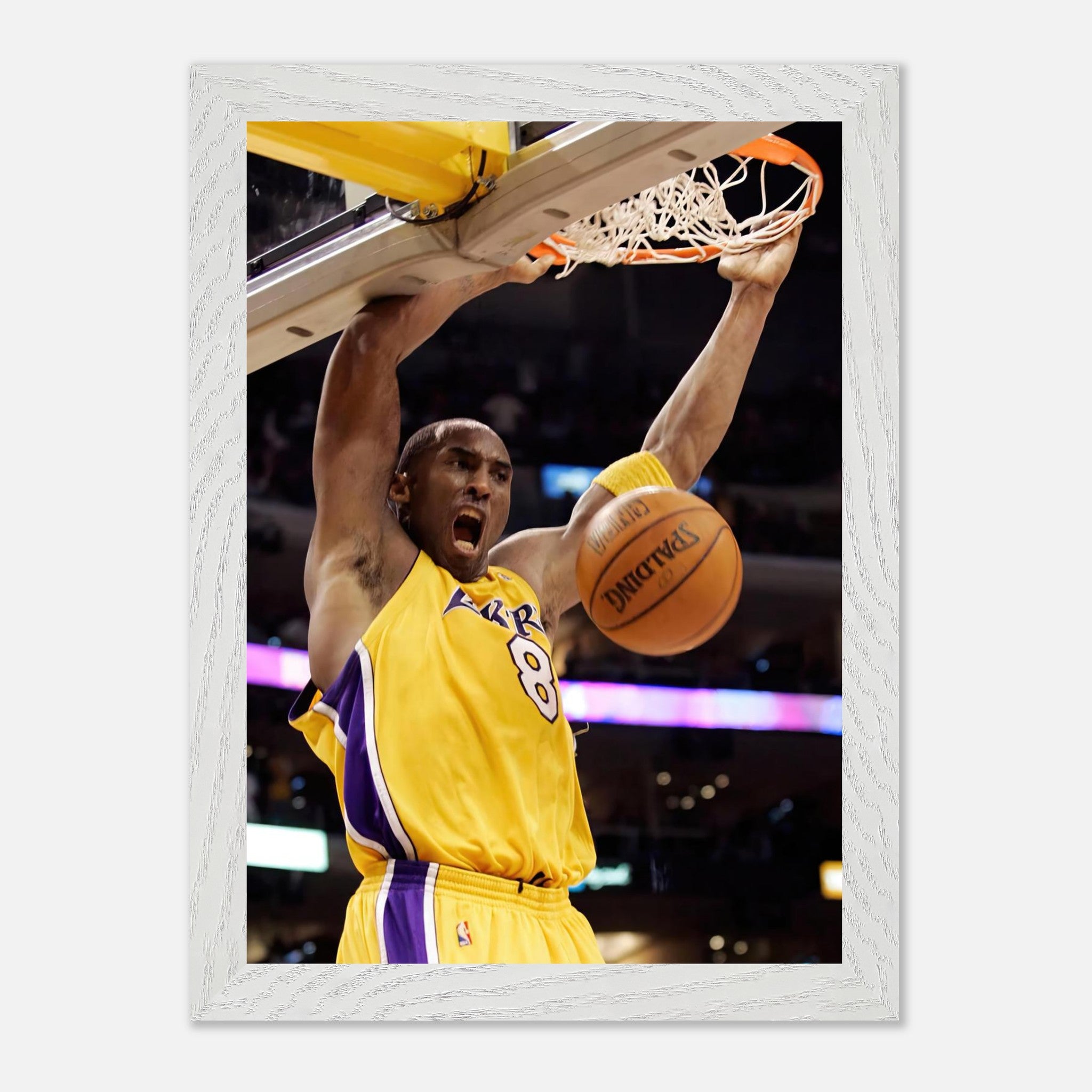 Kobe Bryant's iconic slam dunk vintage framed print showcasing athleticism and intensity on the basketball court.