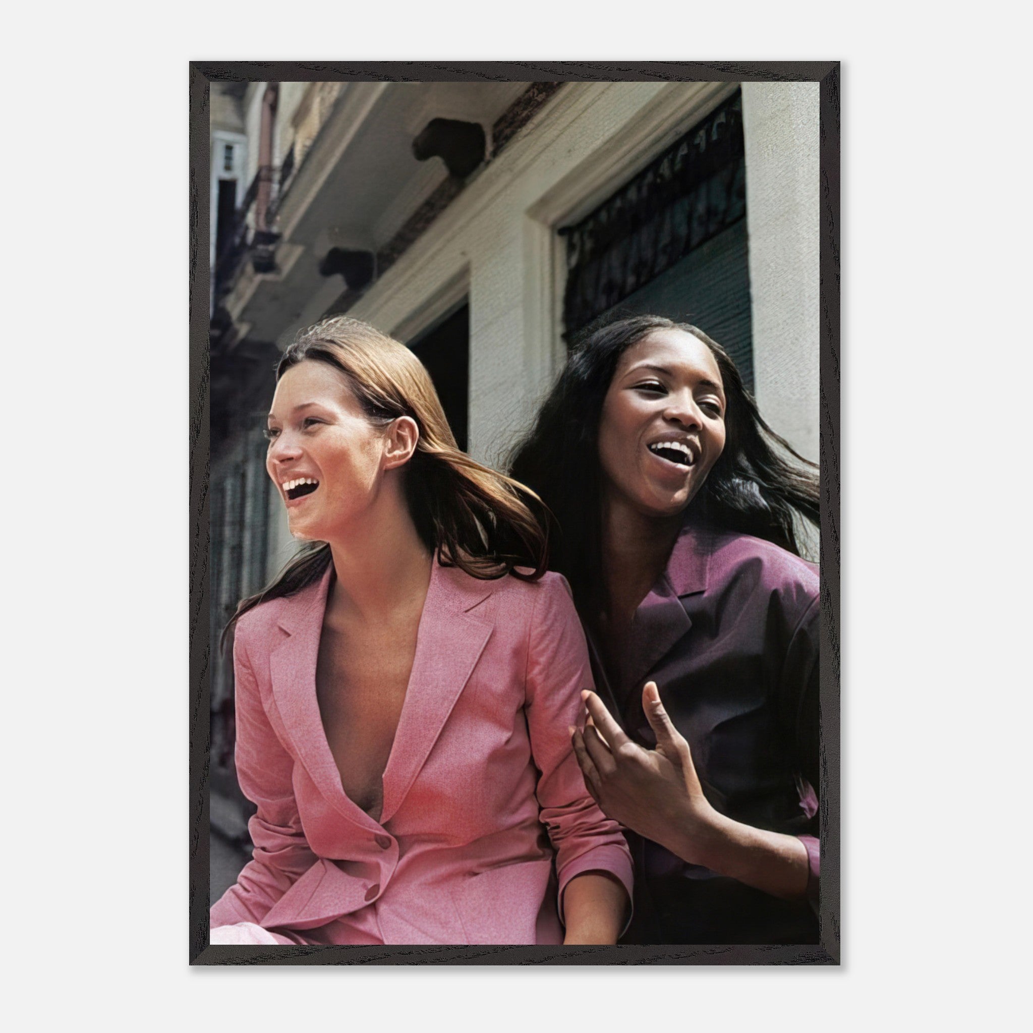Naomi Campbell x Kate Moss Vintage Framed Print showcasing iconic supermodels in a candid, joyful moment, perfect for fashion lovers.