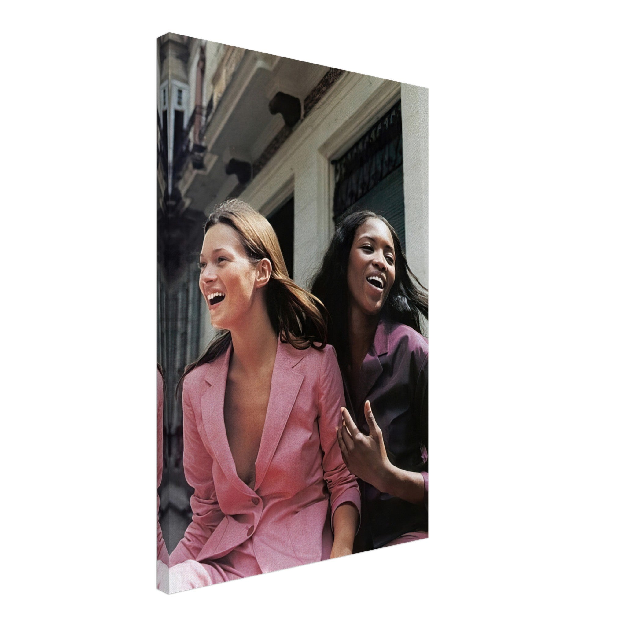 Naomi Campbell and Kate Moss laughing in stylish pink suits, capturing iconic fashion moments on a canvas print.