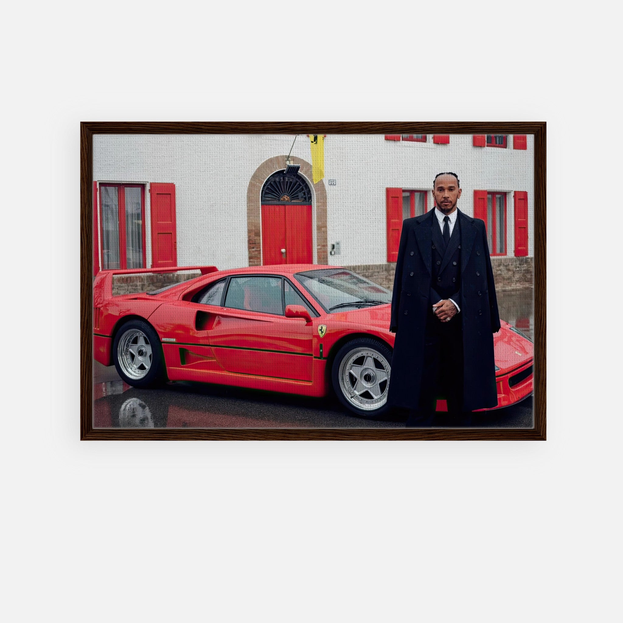 Lewis Hamilton beside Ferrari F40 in front of Enzo Ferrari's home, captured in a framed canvas print.