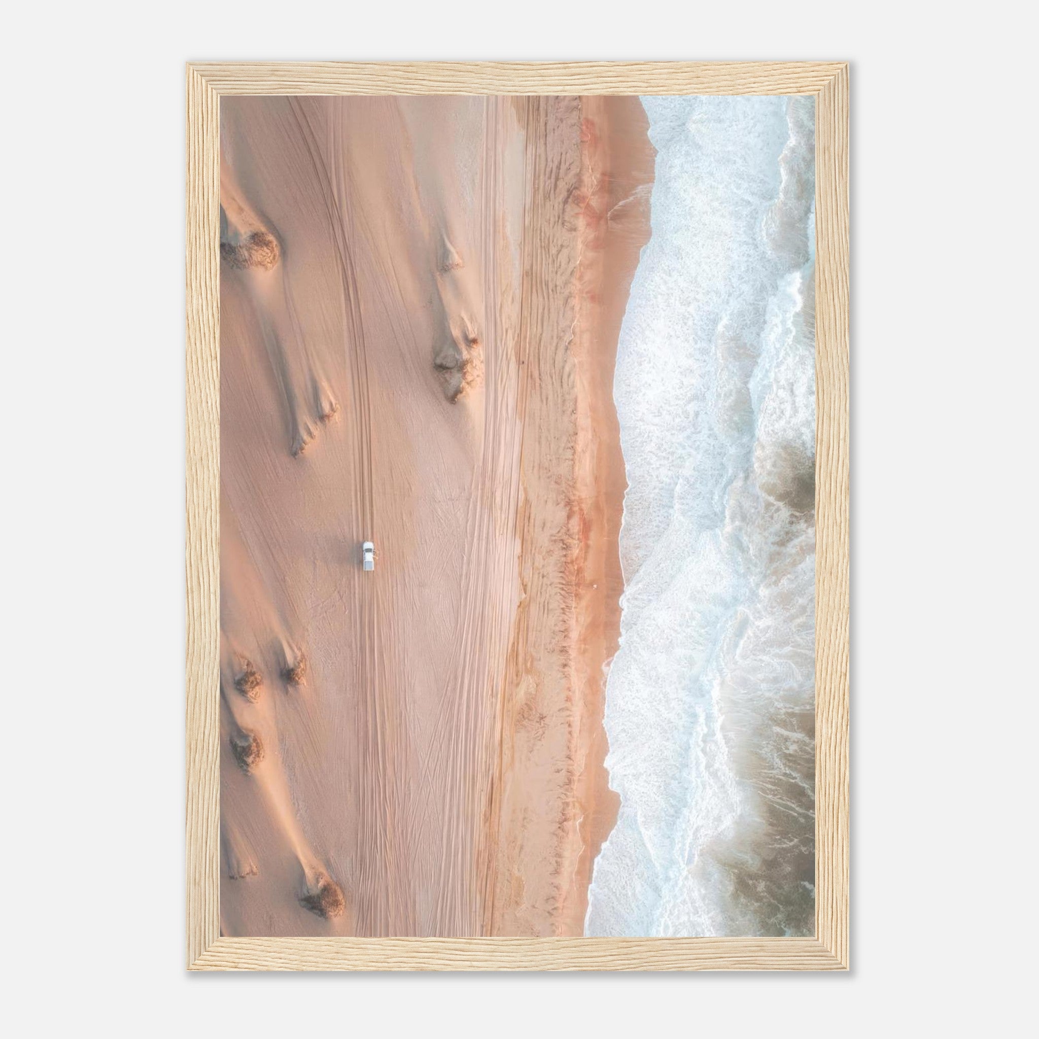 Aerial drone photography print of desert meeting ocean, showcasing sand dunes and crashing waves.