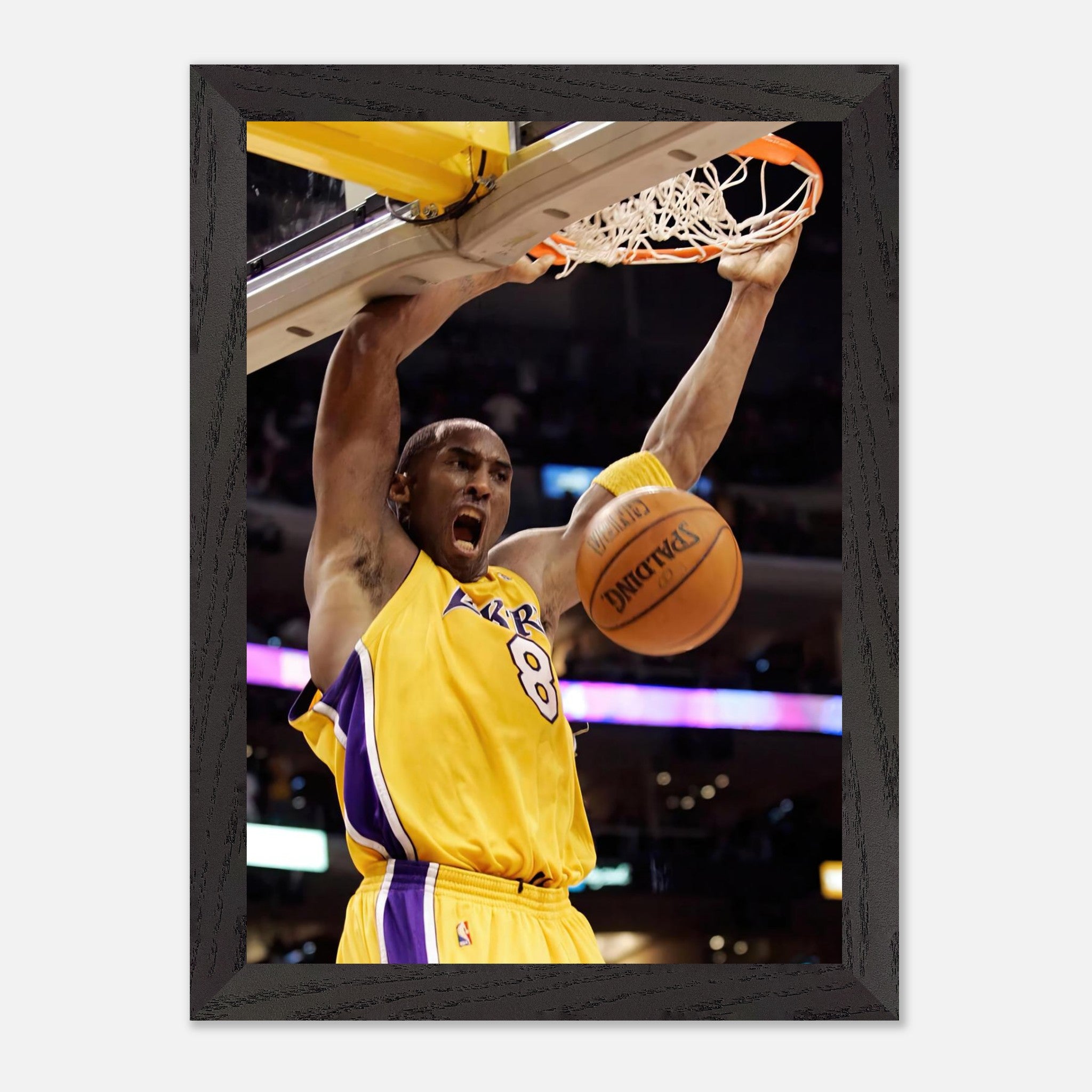 Kobe Bryant vintage framed print featuring his iconic slam dunk in Lakers uniform, showcasing athleticism and intensity.