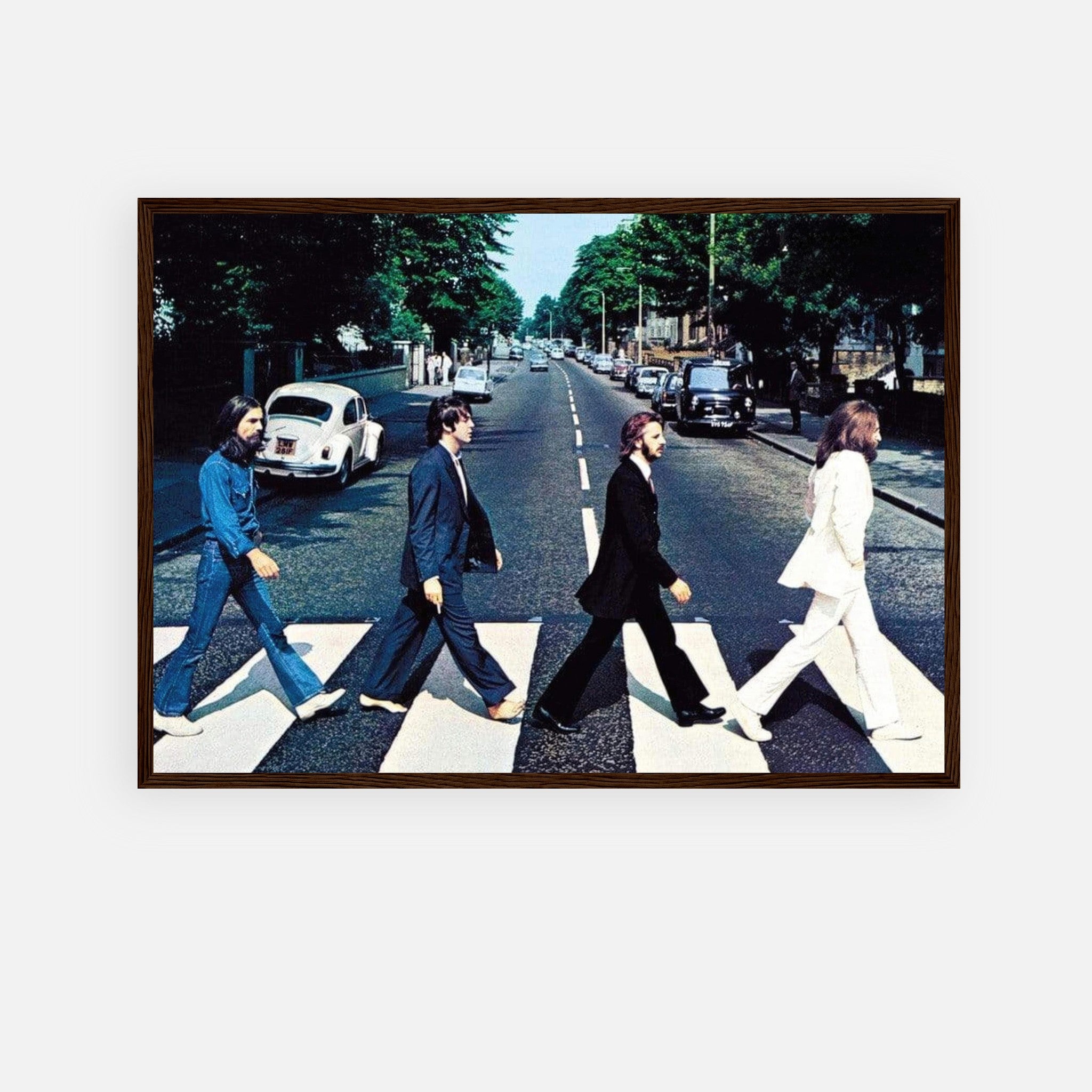 The Beatles Abbey Road framed print featuring band members crossing the street in iconic pose.