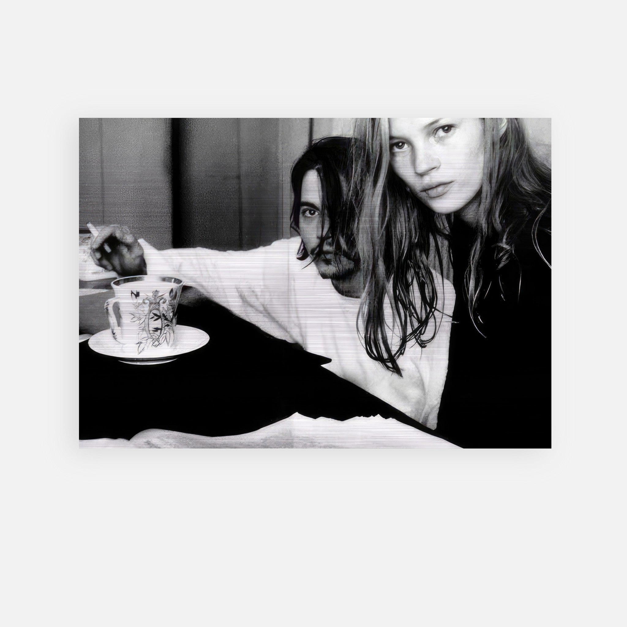 Black and white photo of Johnny Depp and Kate Moss capturing 1990s rebel romance in a brushed metal print.