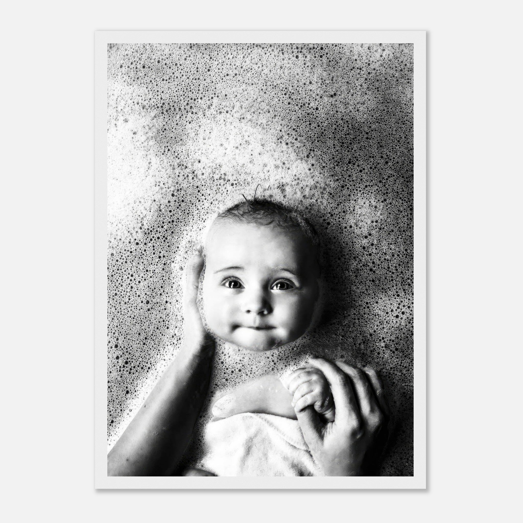 Black-and-white framed print of a joyful baby in a bubble bath, capturing innocence and warmth during bath time.
