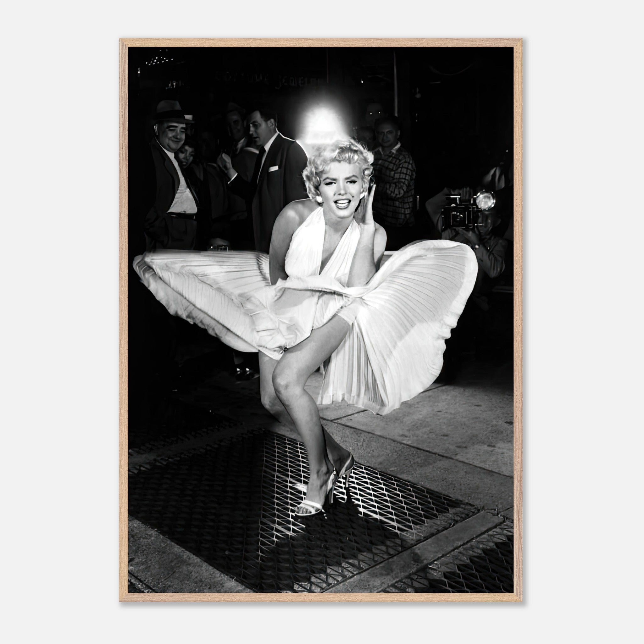 Marilyn Monroe in iconic white dress, playfully surprised by wind, capturing Hollywood glamour in fine art print.