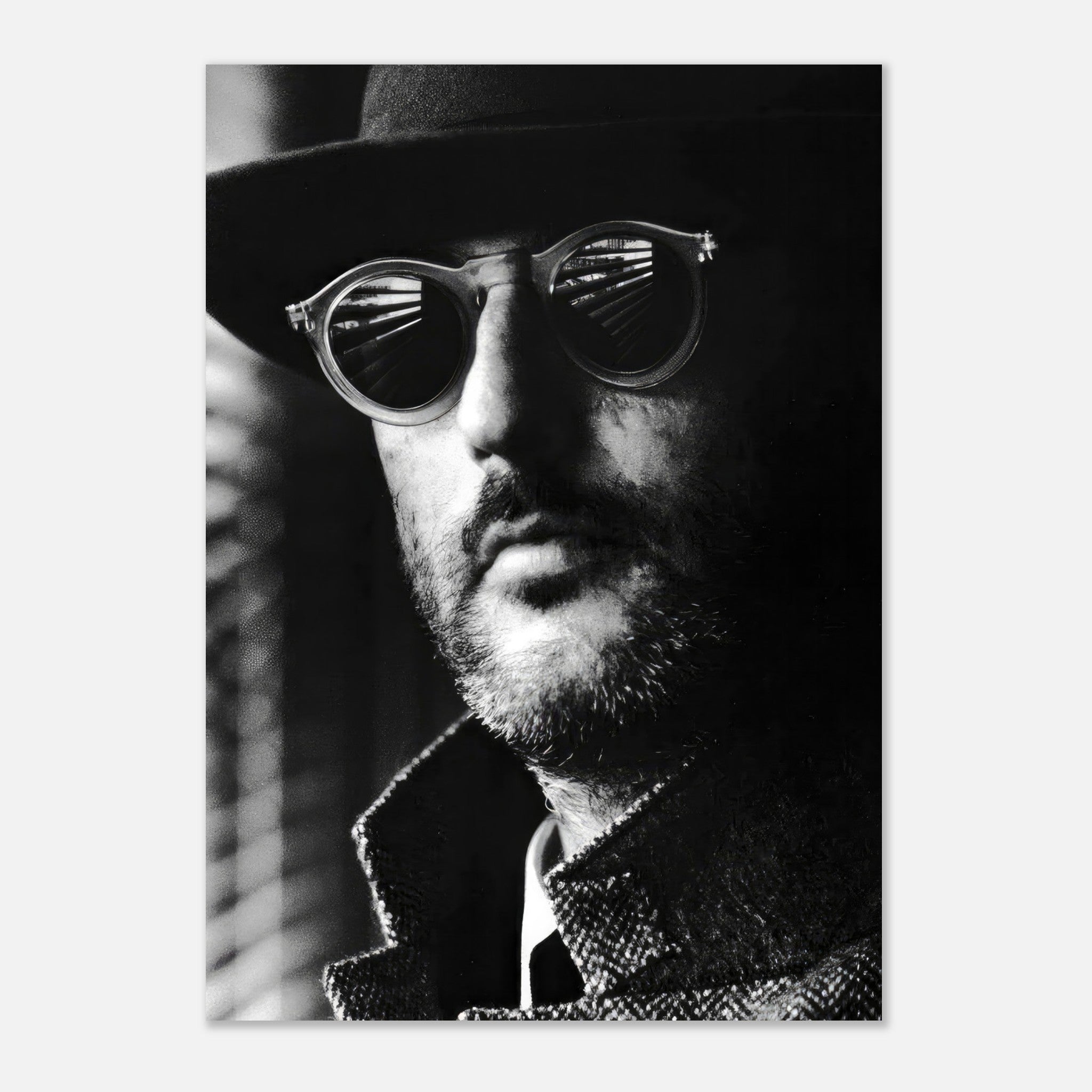 Jean Reno Leon Photography Poster in black-and-white, showcasing the character's mysterious gaze and stylish sunglasses.