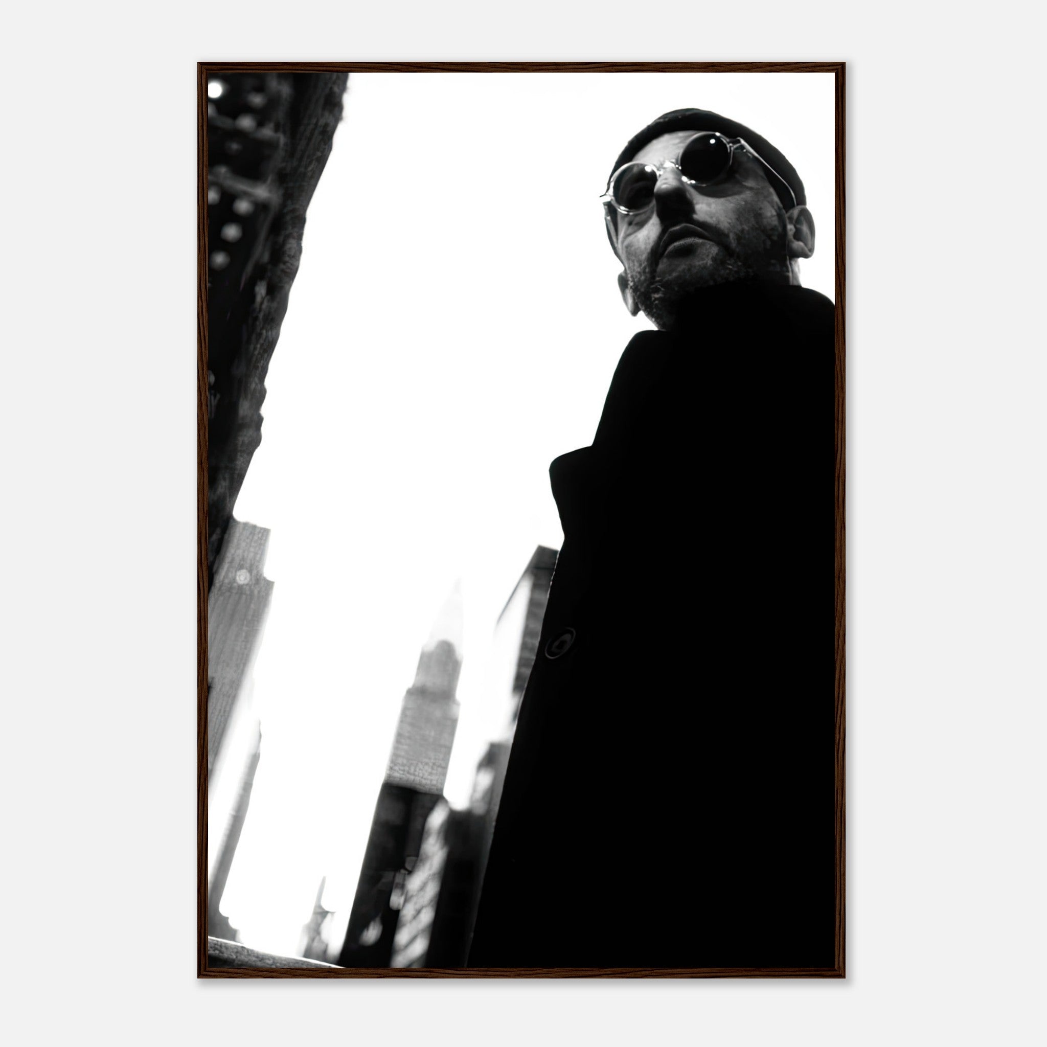Leon Photography Jean Reno framed print in striking black-and-white, showcasing urban elegance and cinematic artistry.