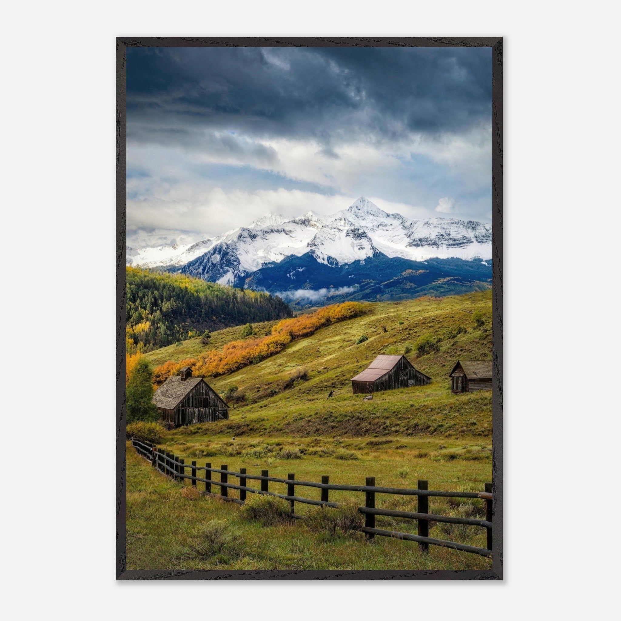 Vintage framed print of Telluride, Colorado, showcasing rolling meadows, rustic barns, and snow-capped peaks.