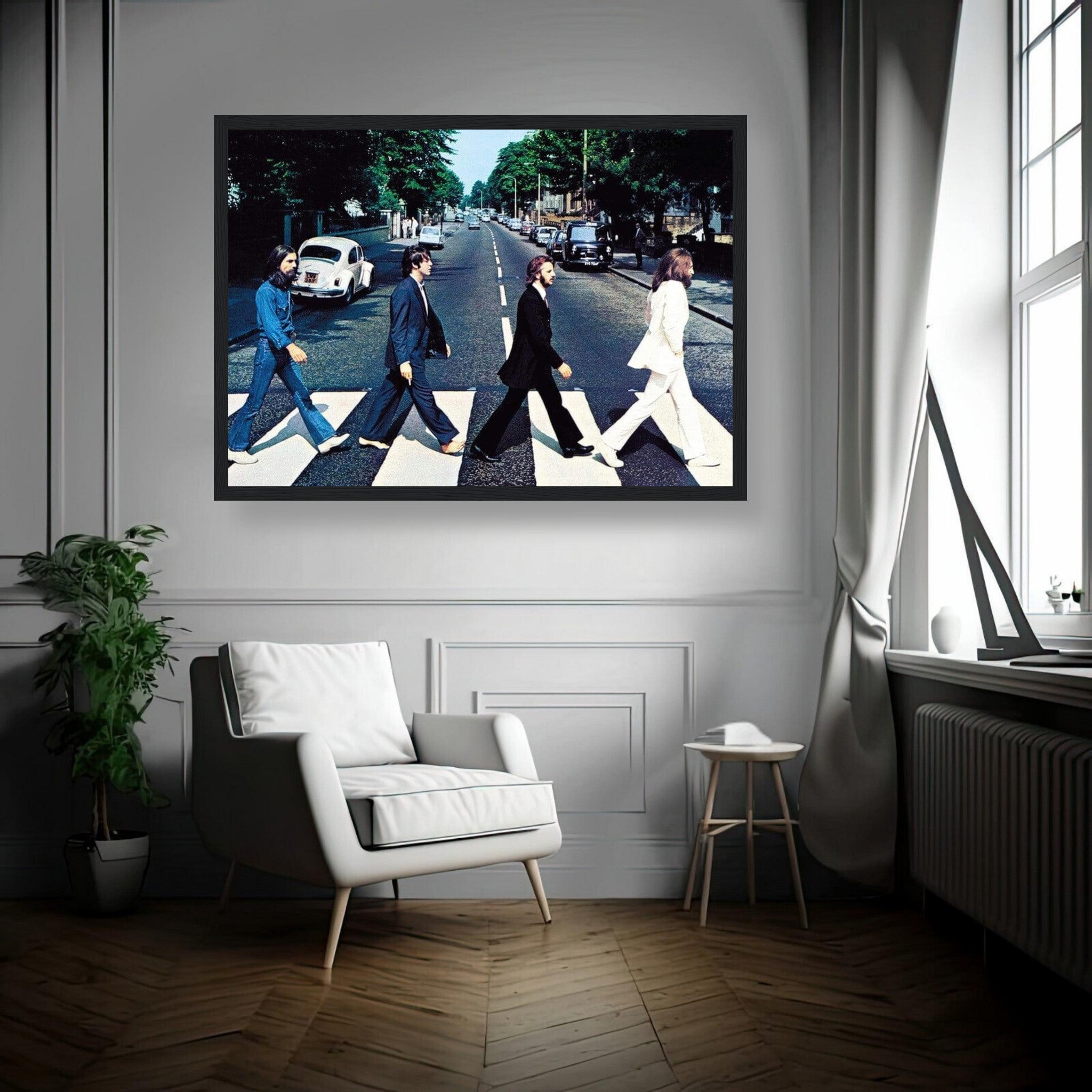 The Beatles Abbey Road framed print displayed on a wall in a stylish living room with modern furnishings.