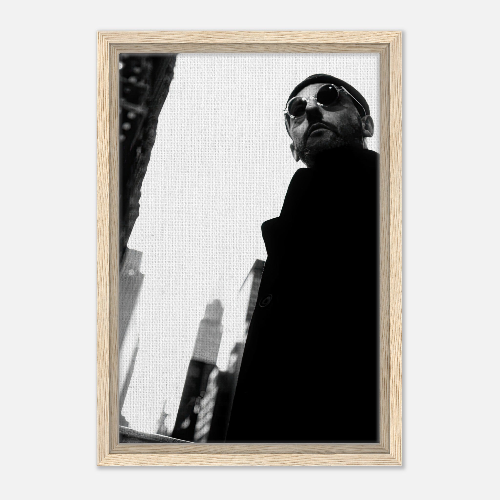 Leon Photography framed canvas print of Jean Reno in black-and-white, showcasing urban sophistication and enigmatic charm.