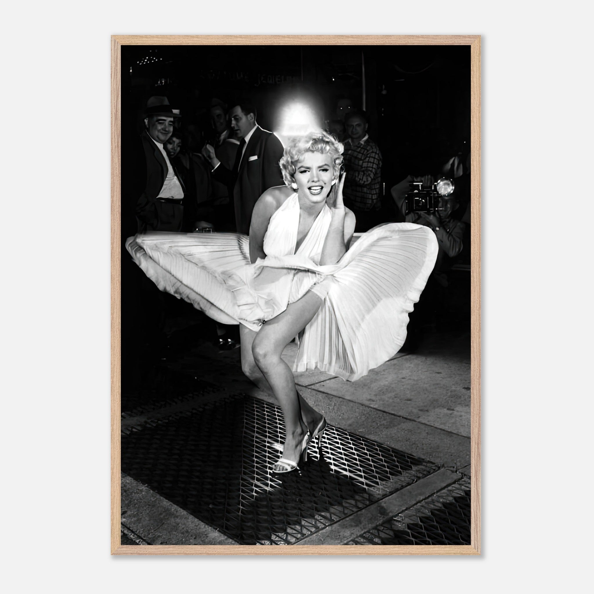 Vintage framed print of Marilyn Monroe in white dress, gracefully captured in a wind-blown moment.