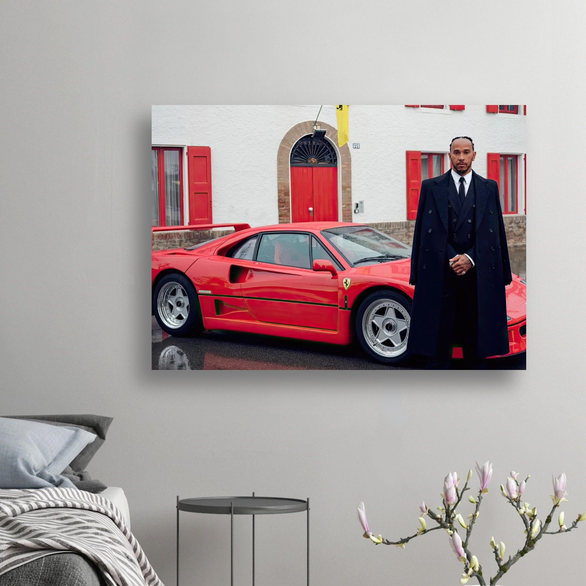 Lewis Hamilton standing beside a Ferrari F40 in front of Enzo Ferrari’s home, celebrating speed and style.