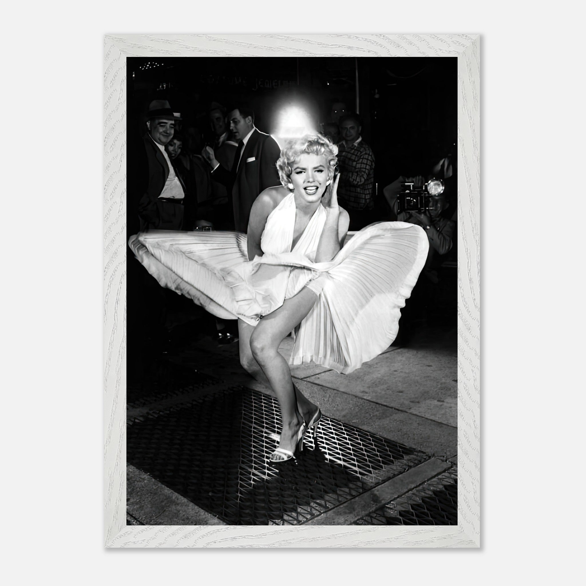 Marilyn Monroe in white dress caught in wind, vintage framed print showcasing Hollywood glamour.