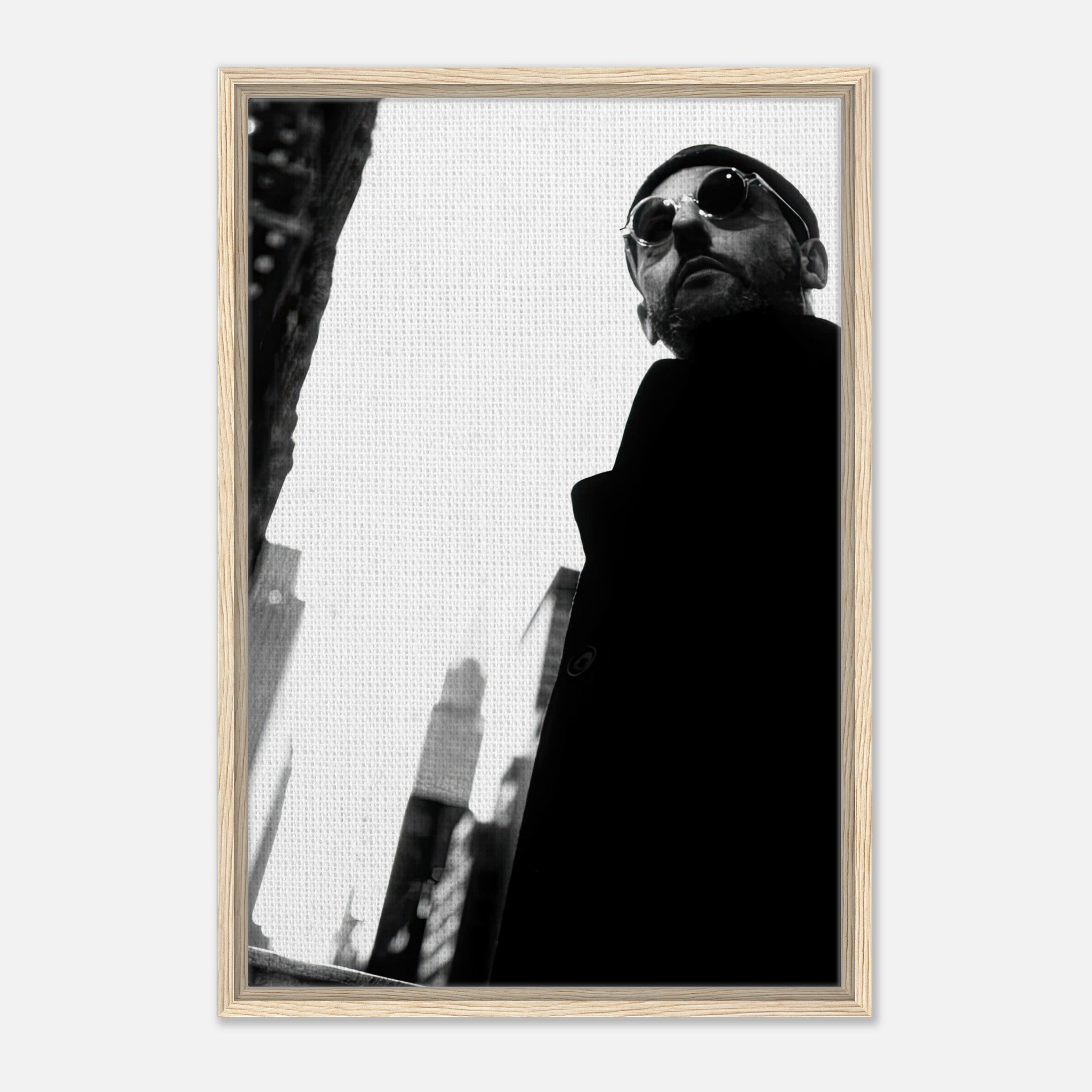Framed canvas print of Jean Reno in black-and-white, showcasing urban sophistication and enigmatic charm.