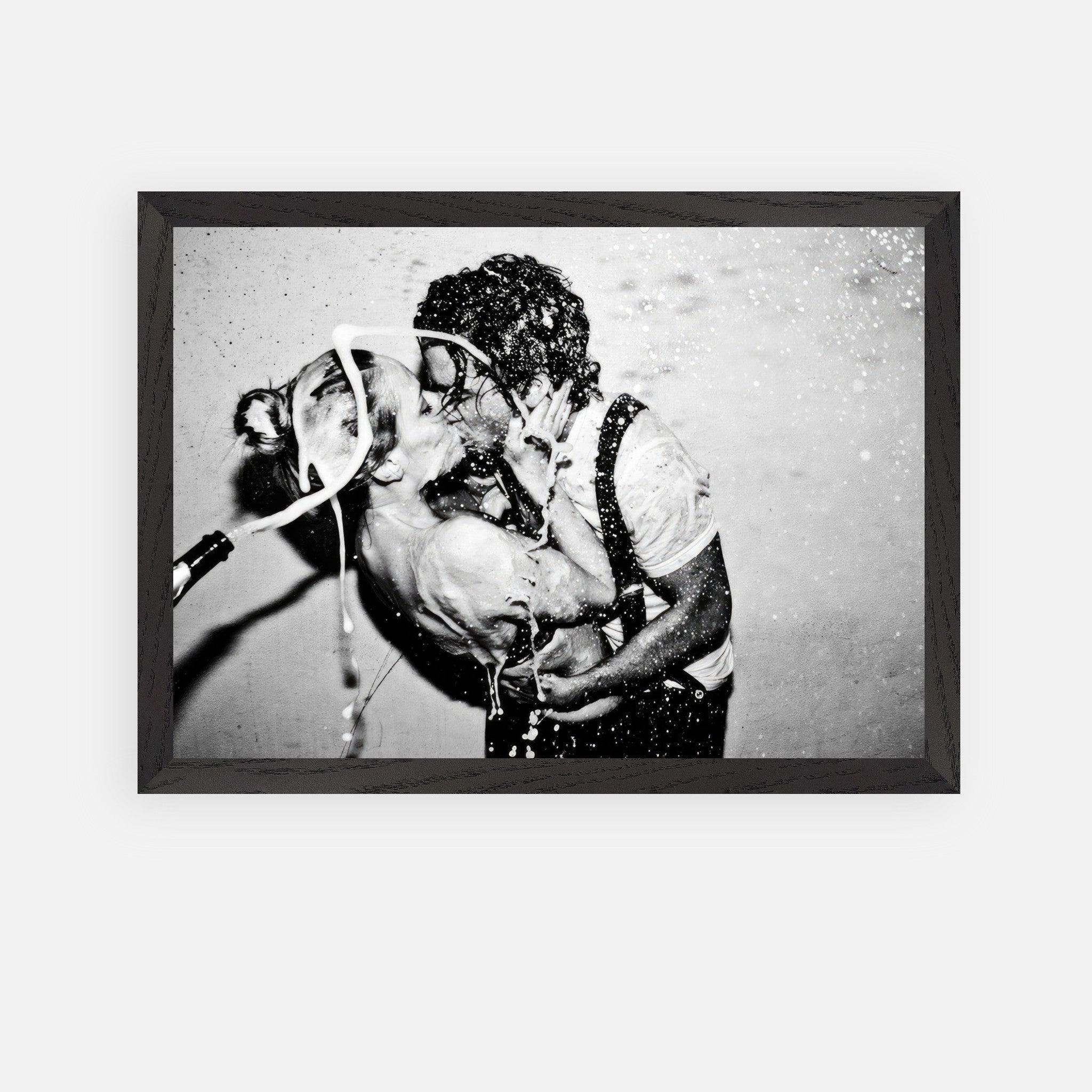 Vintage framed art of Johnny Depp and Kate Moss sharing a passionate kiss with champagne celebrating their romance.