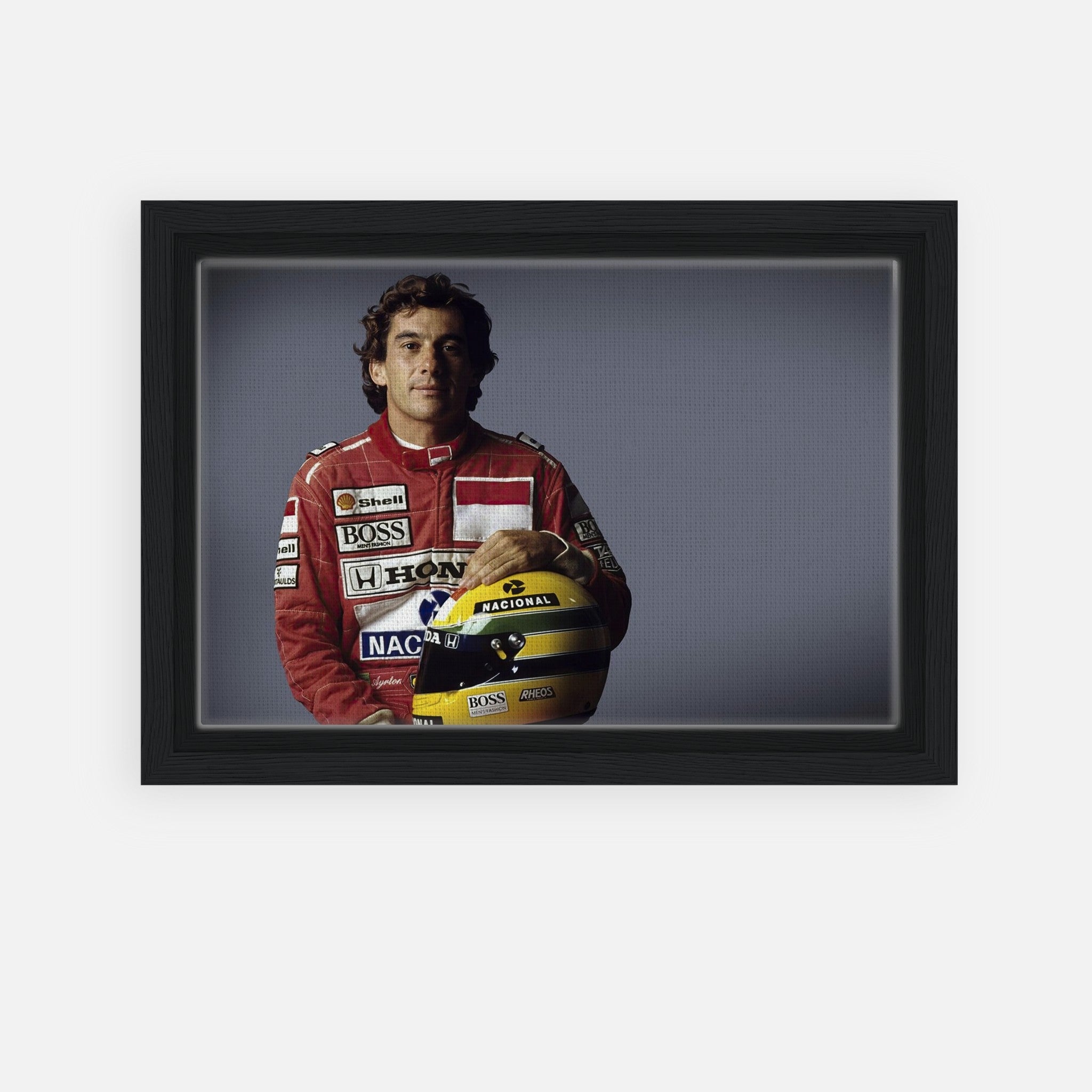 Ayrton Senna framed canvas print featuring the racing legend with his helmet.