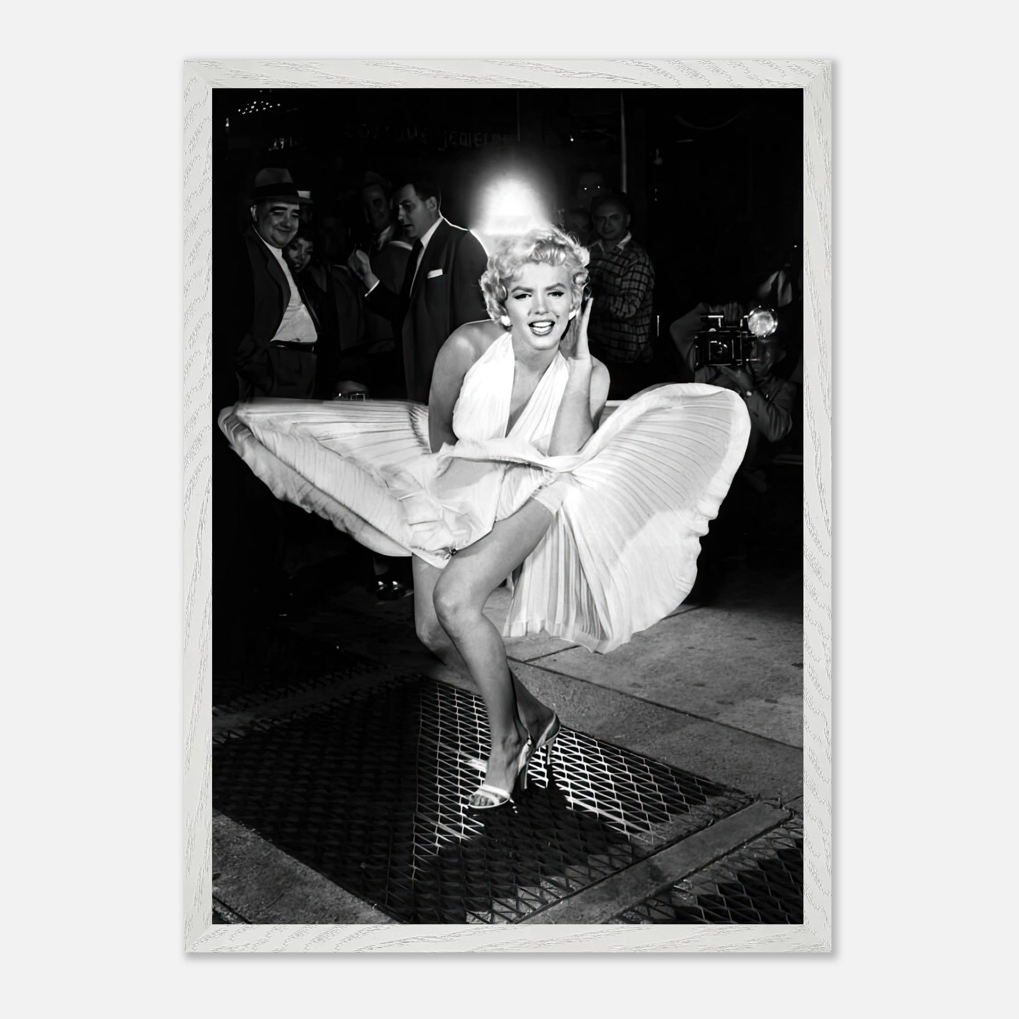 Vintage framed print of Marilyn Monroe in white dress blown by wind, embodying Hollywood glamour.
